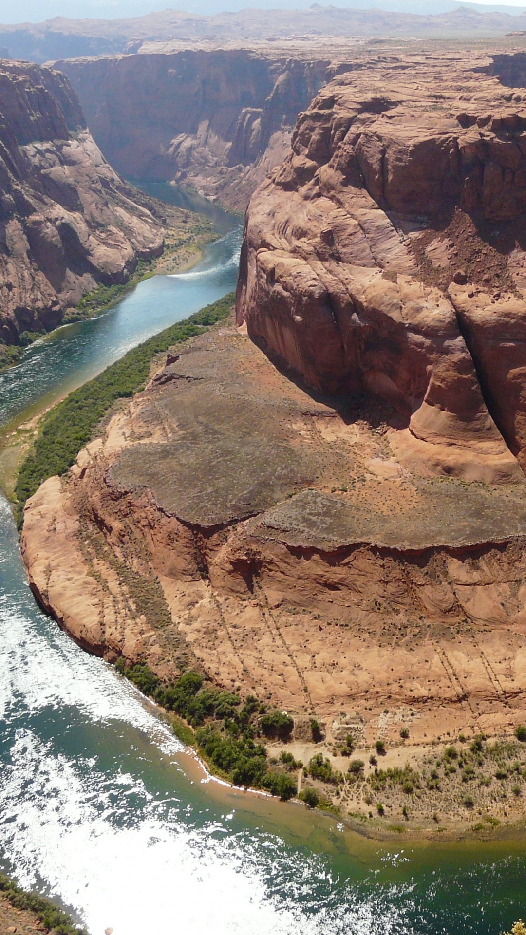 Brown Rock Formation Near Body of Water During Daytime. Wallpaper in 1080x1920 Resolution