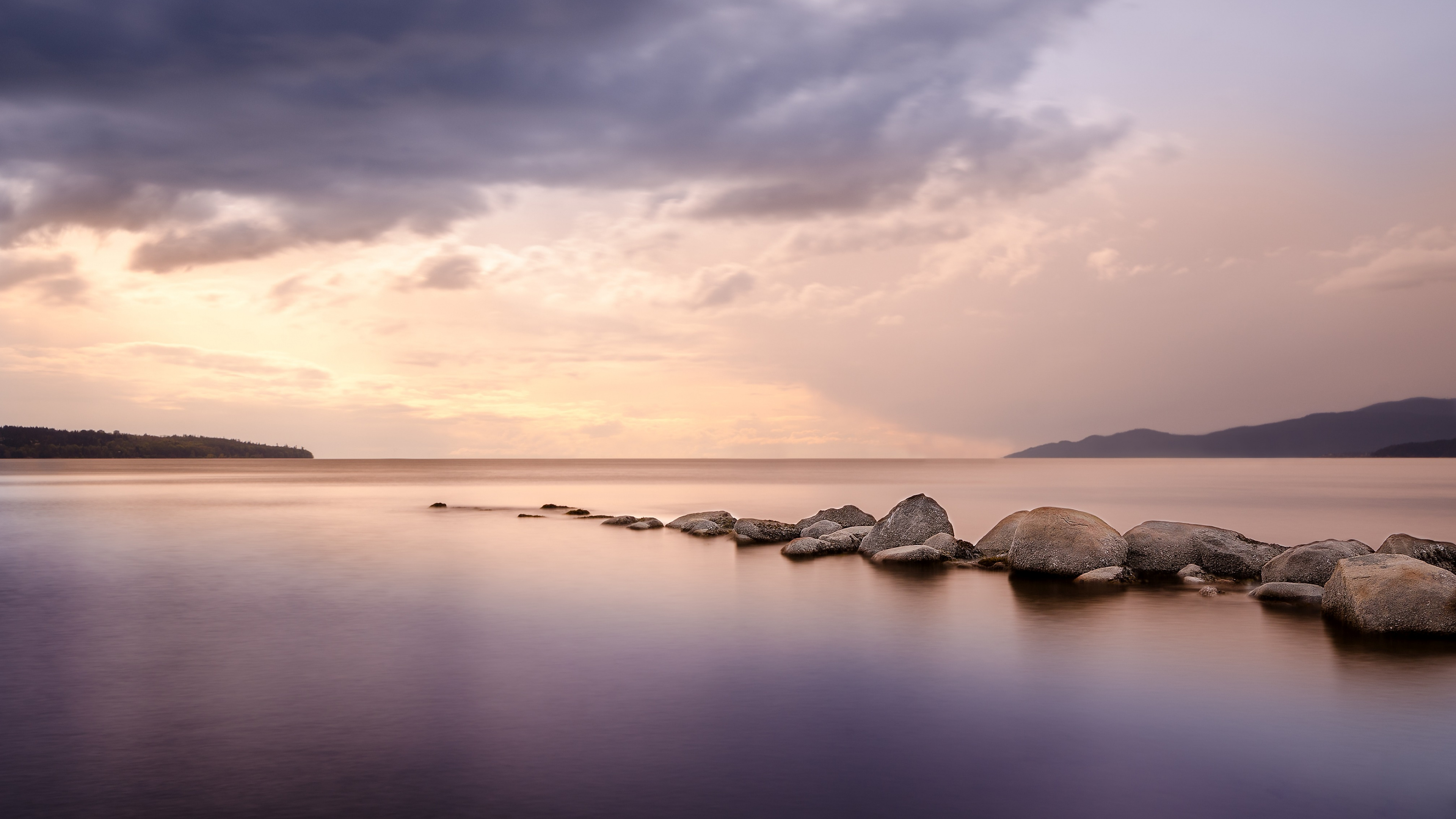 Gray Rocks on Body of Water Under Gray Clouds. Wallpaper in 3840x2160 Resolution