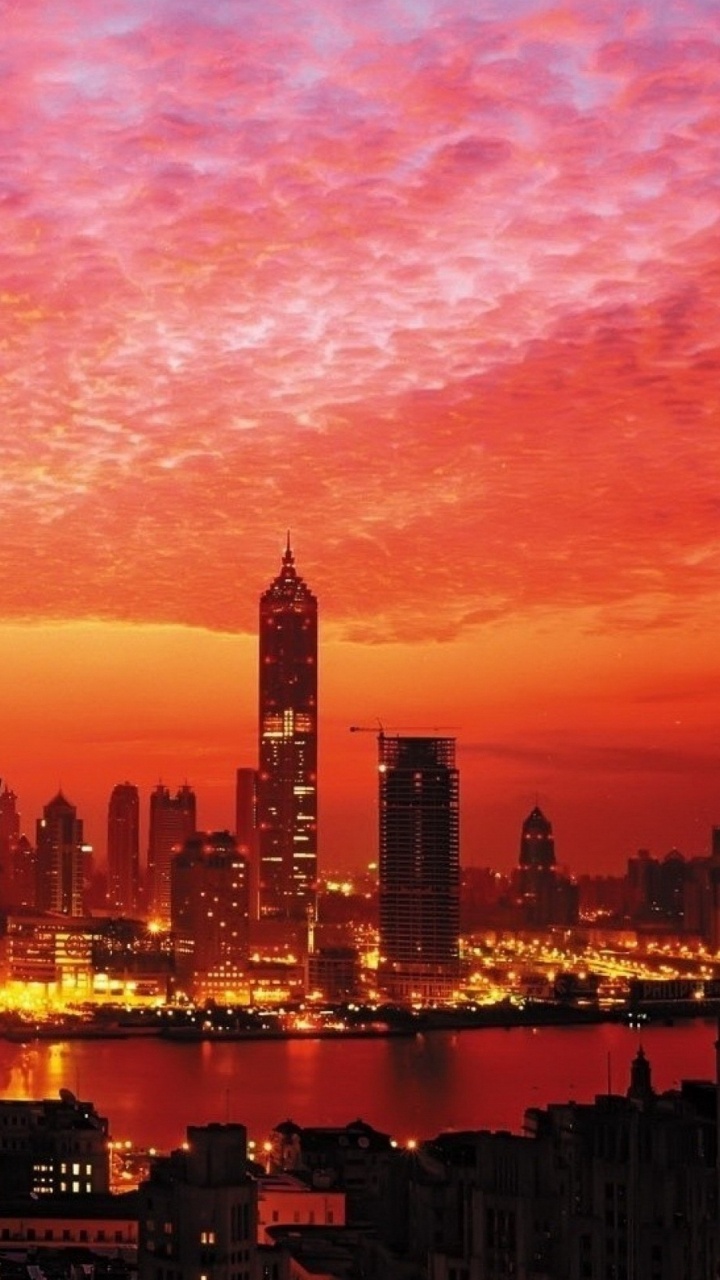 City Skyline During Night Time. Wallpaper in 720x1280 Resolution