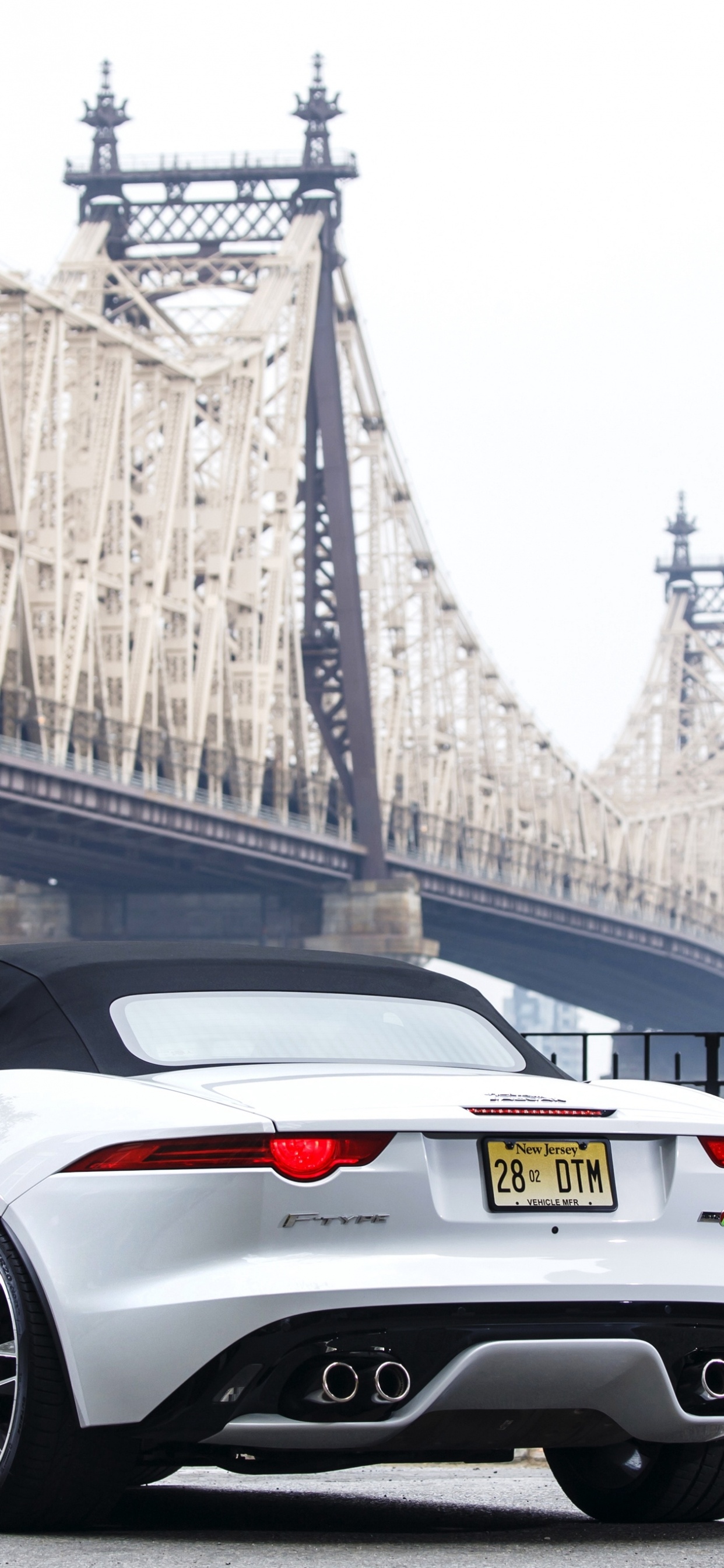 White Porsche 911 Parked on Bridge During Daytime. Wallpaper in 1242x2688 Resolution