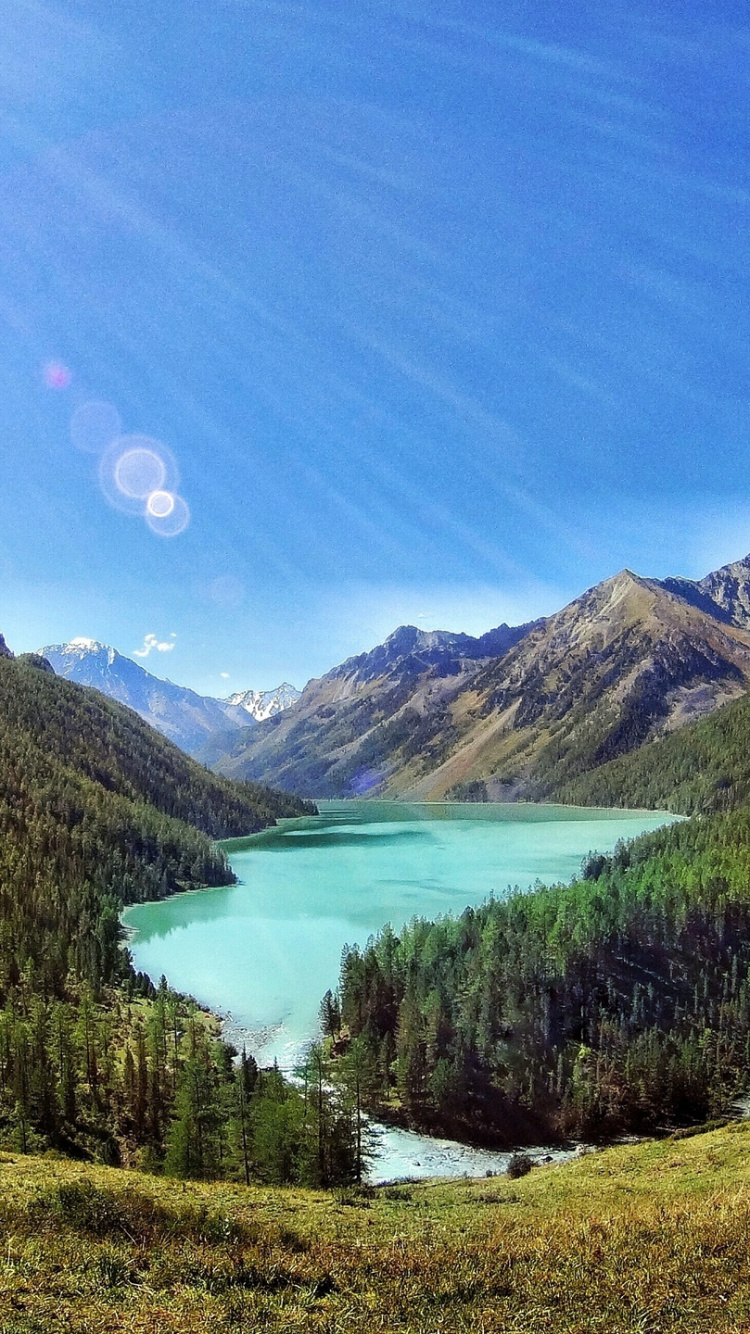 Green Lake in The Middle of Mountains During Daytime. Wallpaper in 750x1334 Resolution