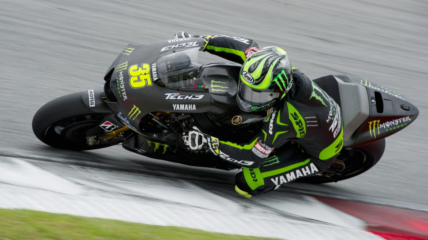Homme en Costume de Moto Vert et Noir à Cheval Sur un Vélo de Sport Noir et Jaune. Wallpaper in 1366x768 Resolution