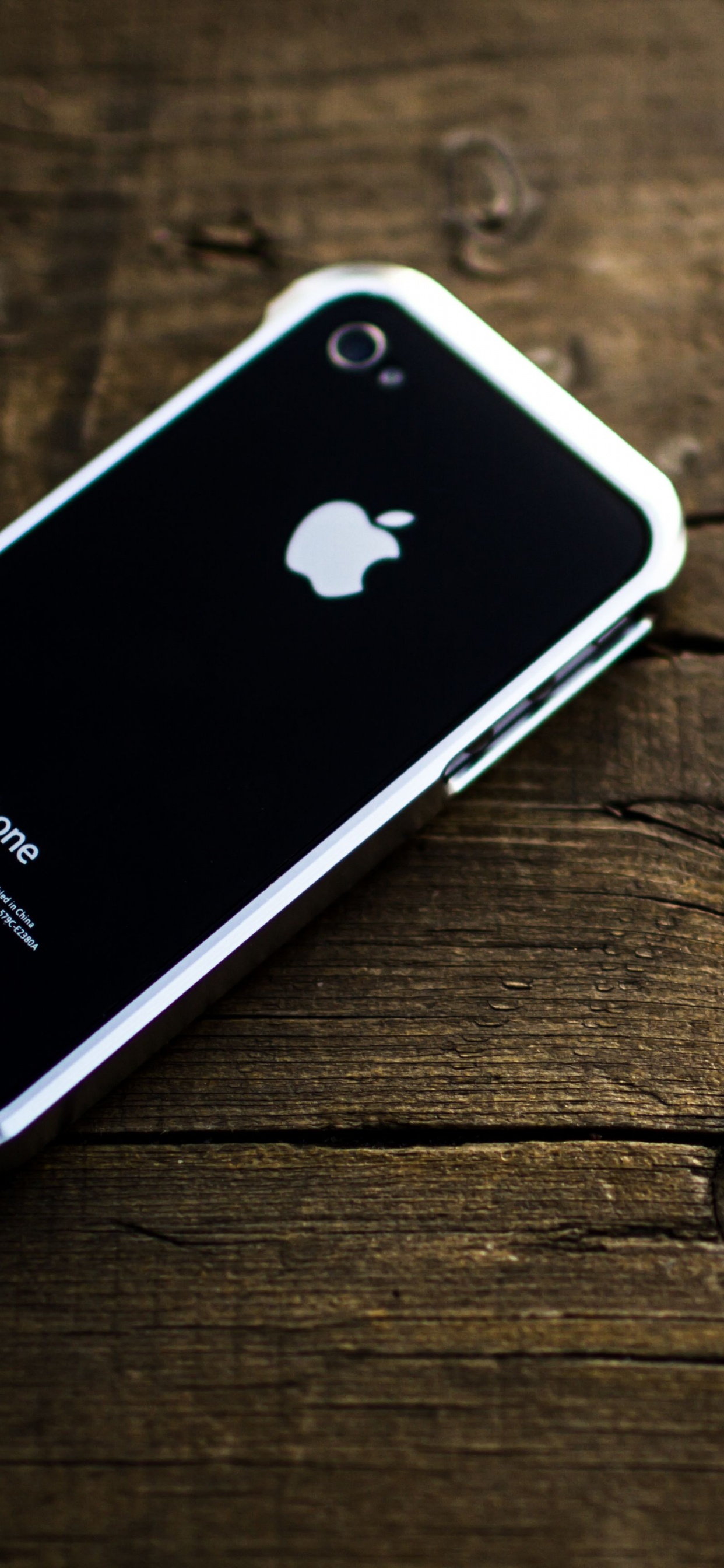 Black Iphone 4 on Brown Wooden Table. Wallpaper in 1242x2688 Resolution