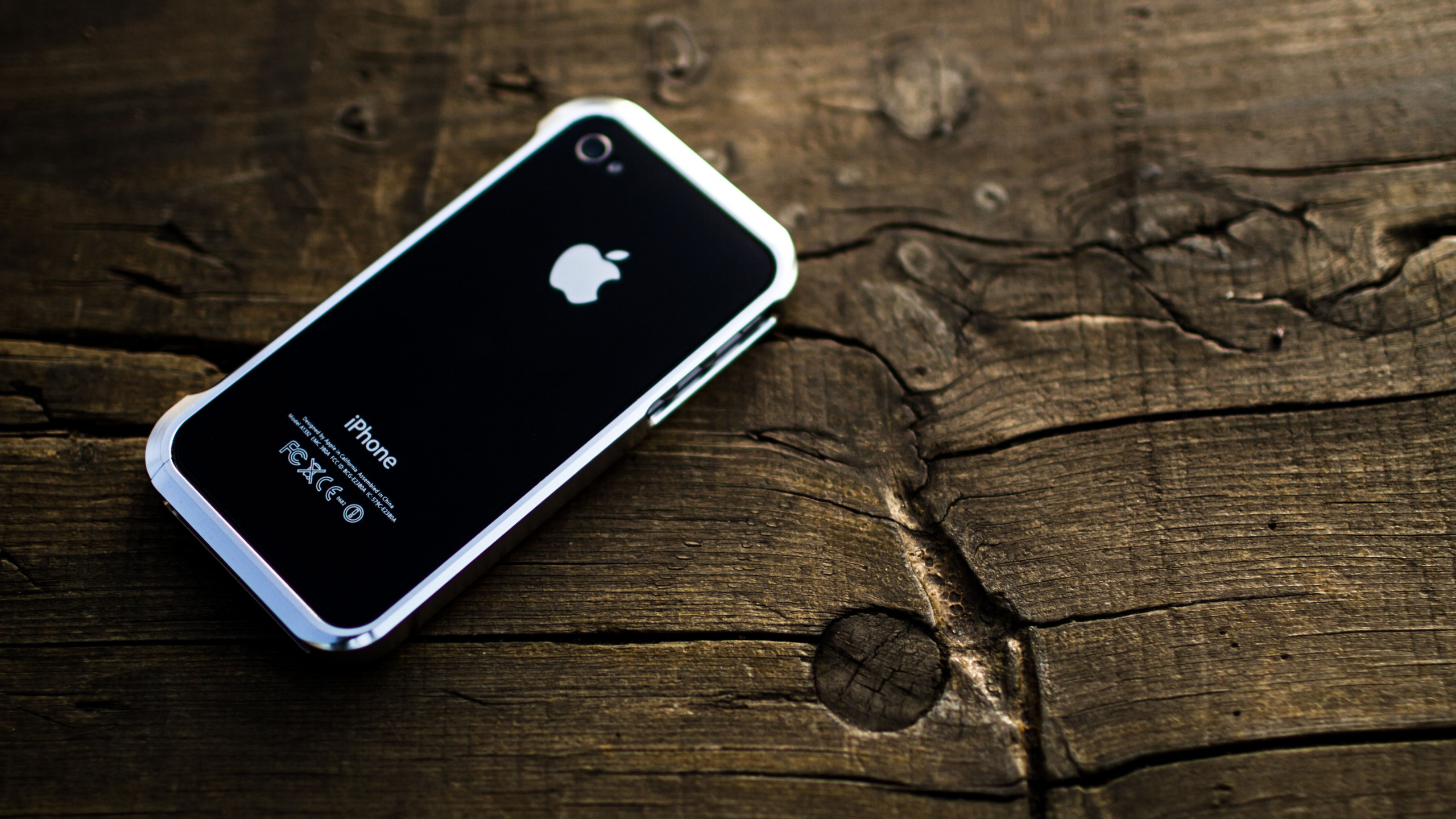 Black Iphone 4 on Brown Wooden Table. Wallpaper in 2560x1440 Resolution