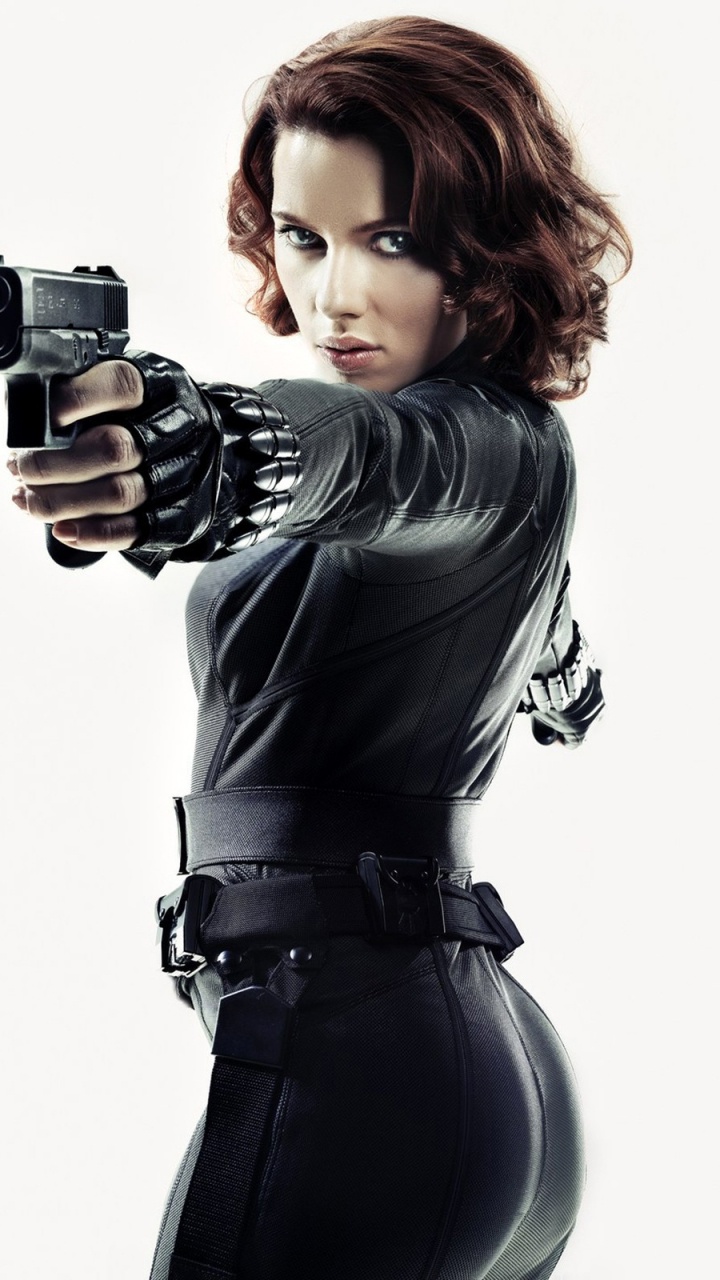 Woman in Black Leather Jacket Holding Black Camera. Wallpaper in 720x1280 Resolution