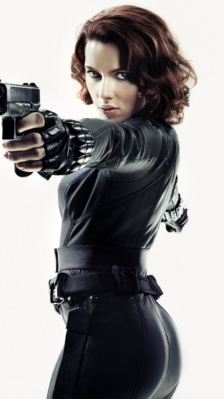 Woman in Black Leather Jacket Holding Black Camera. Wallpaper in 750x1334 Resolution