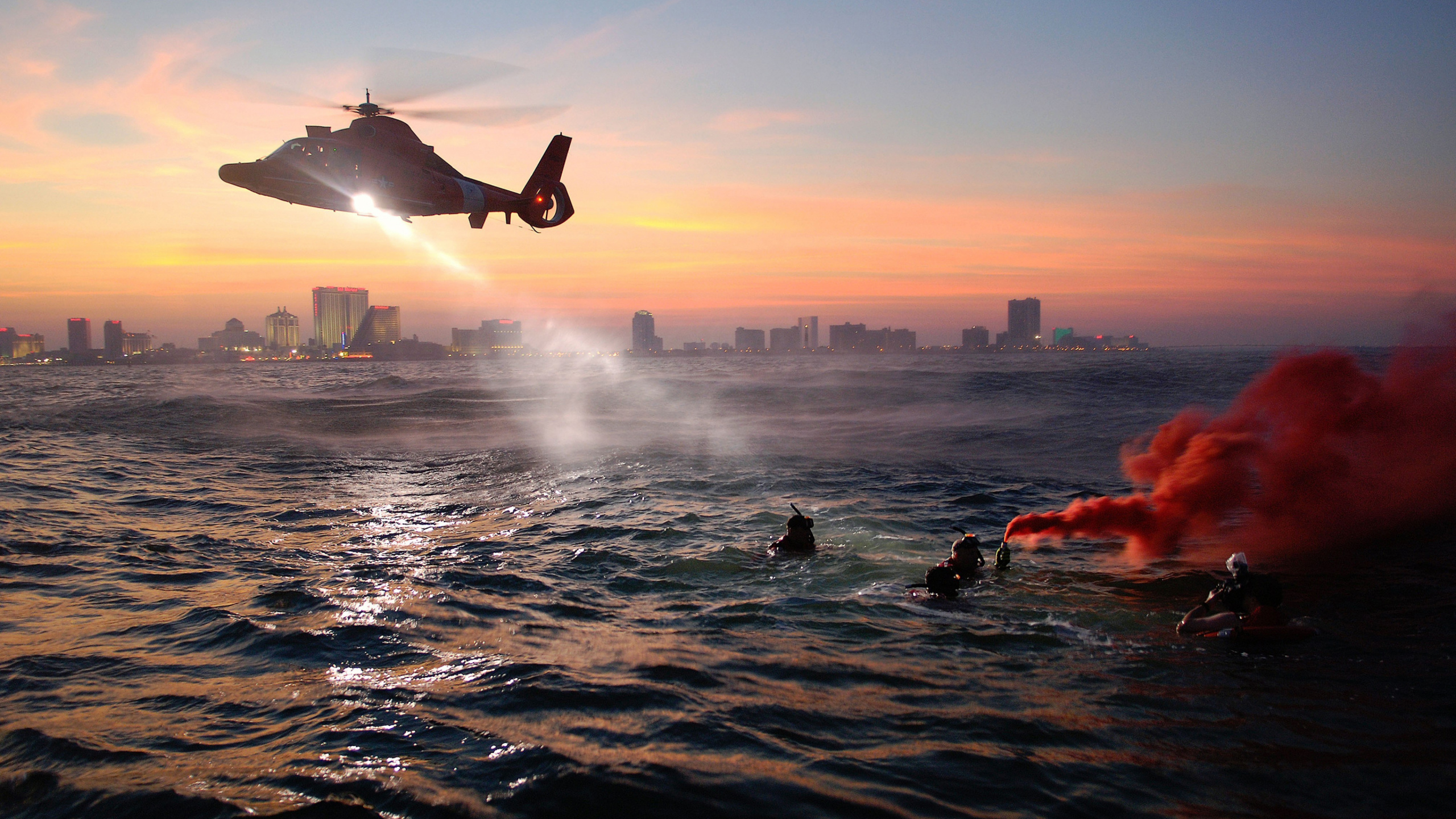 People in Water During Sunset. Wallpaper in 2560x1440 Resolution