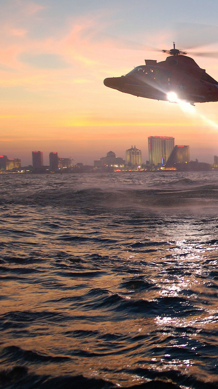 People in Water During Sunset. Wallpaper in 750x1334 Resolution