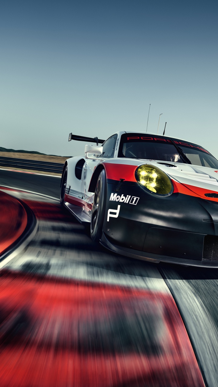 Schwarz-roter Porsche 911 Unterwegs. Wallpaper in 720x1280 Resolution