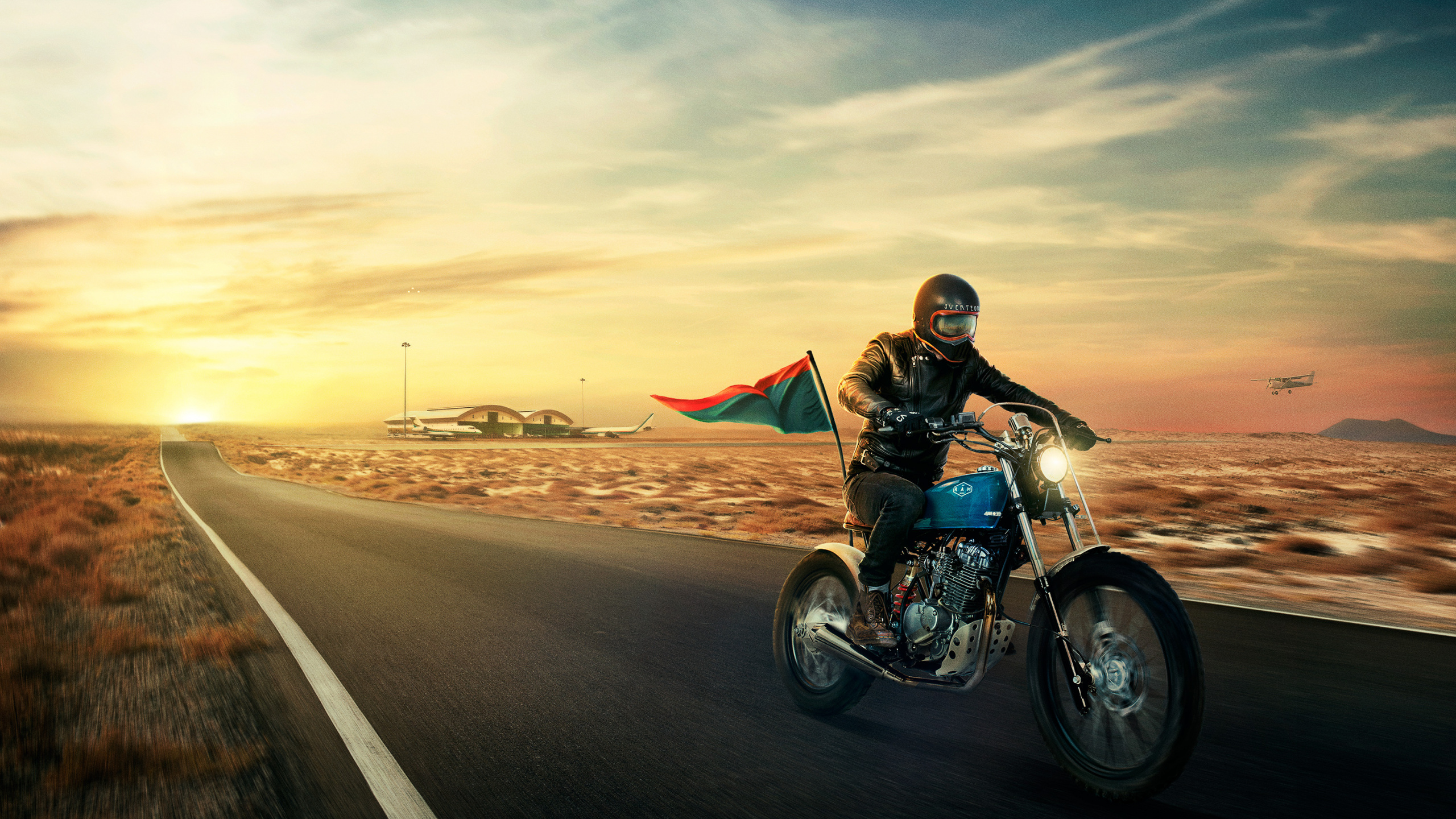 Homme Monté Sur Moto Sur Route Pendant la Journée. Wallpaper in 2560x1440 Resolution