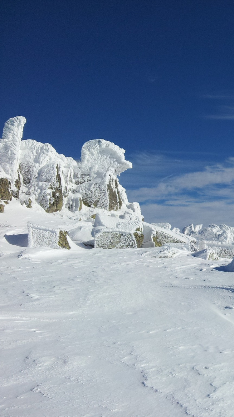 Snow Covered Mountain Under Blue Sky During Daytime. Wallpaper in 750x1334 Resolution