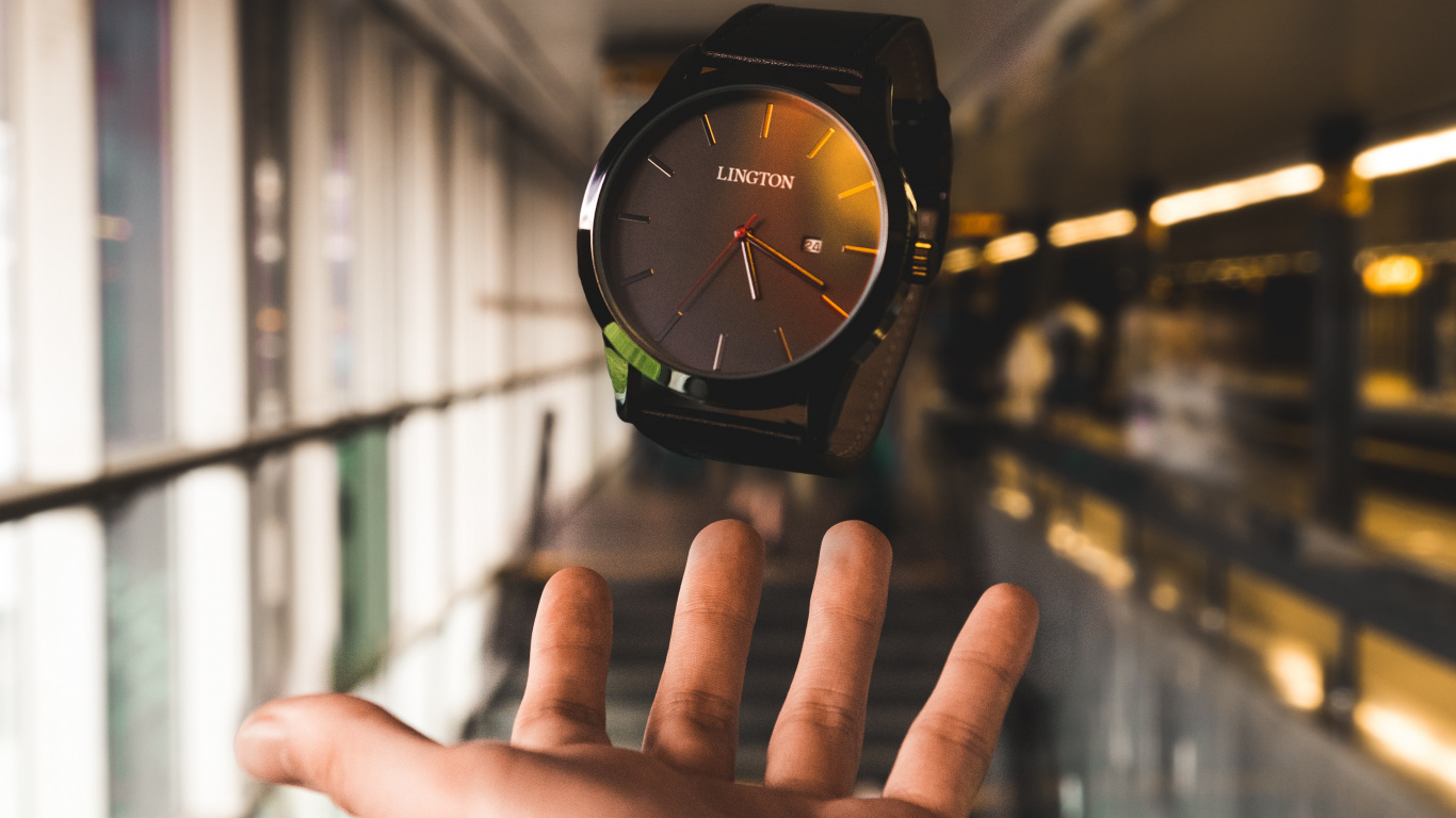 Person Wearing Black and Green Analog Watch. Wallpaper in 1366x768 Resolution