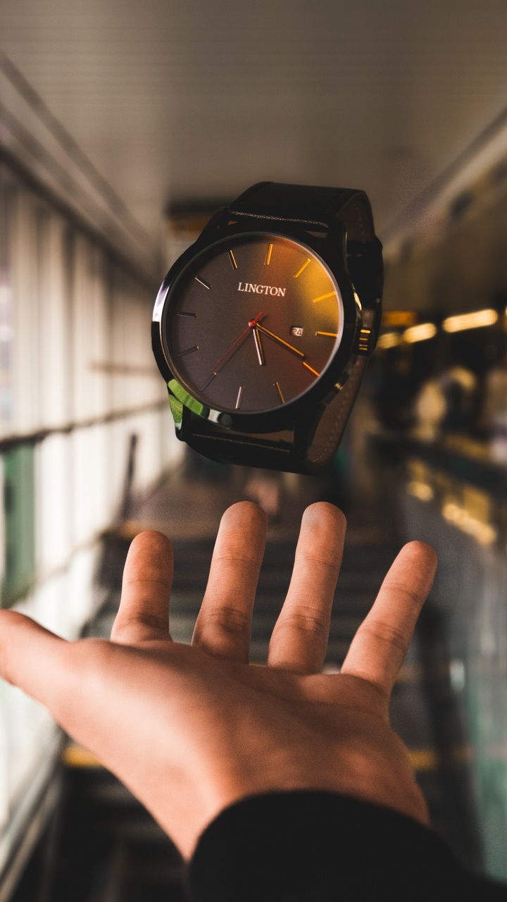 Person Wearing Black and Green Analog Watch. Wallpaper in 720x1280 Resolution