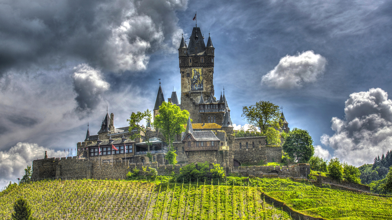 Green and Yellow Castle Under Cloudy Sky. Wallpaper in 1280x720 Resolution