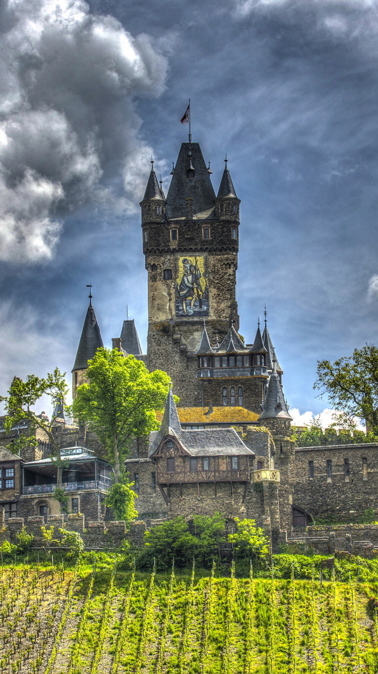 Green and Yellow Castle Under Cloudy Sky. Wallpaper in 750x1334 Resolution