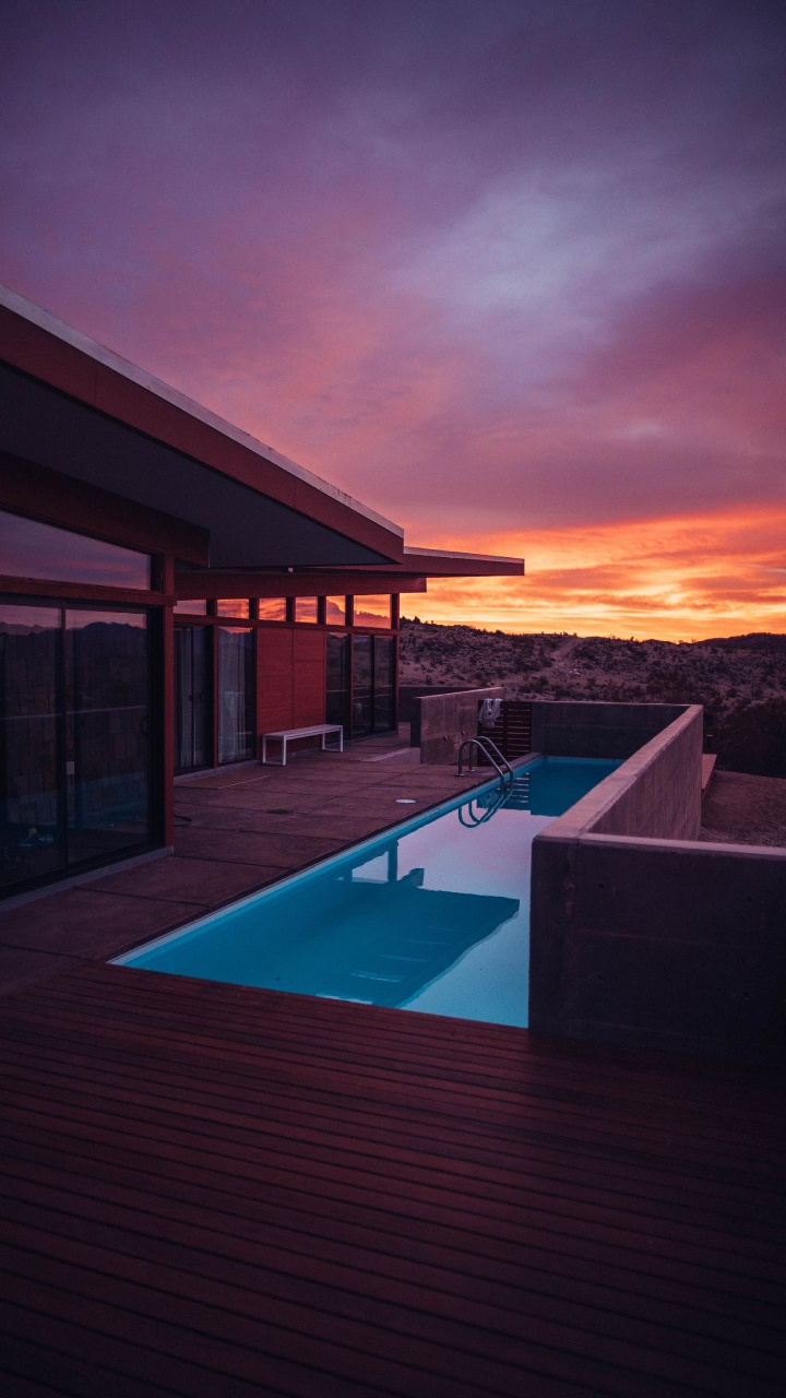 Swimming Pool Near Brown Wooden House During Sunset. Wallpaper in 720x1280 Resolution