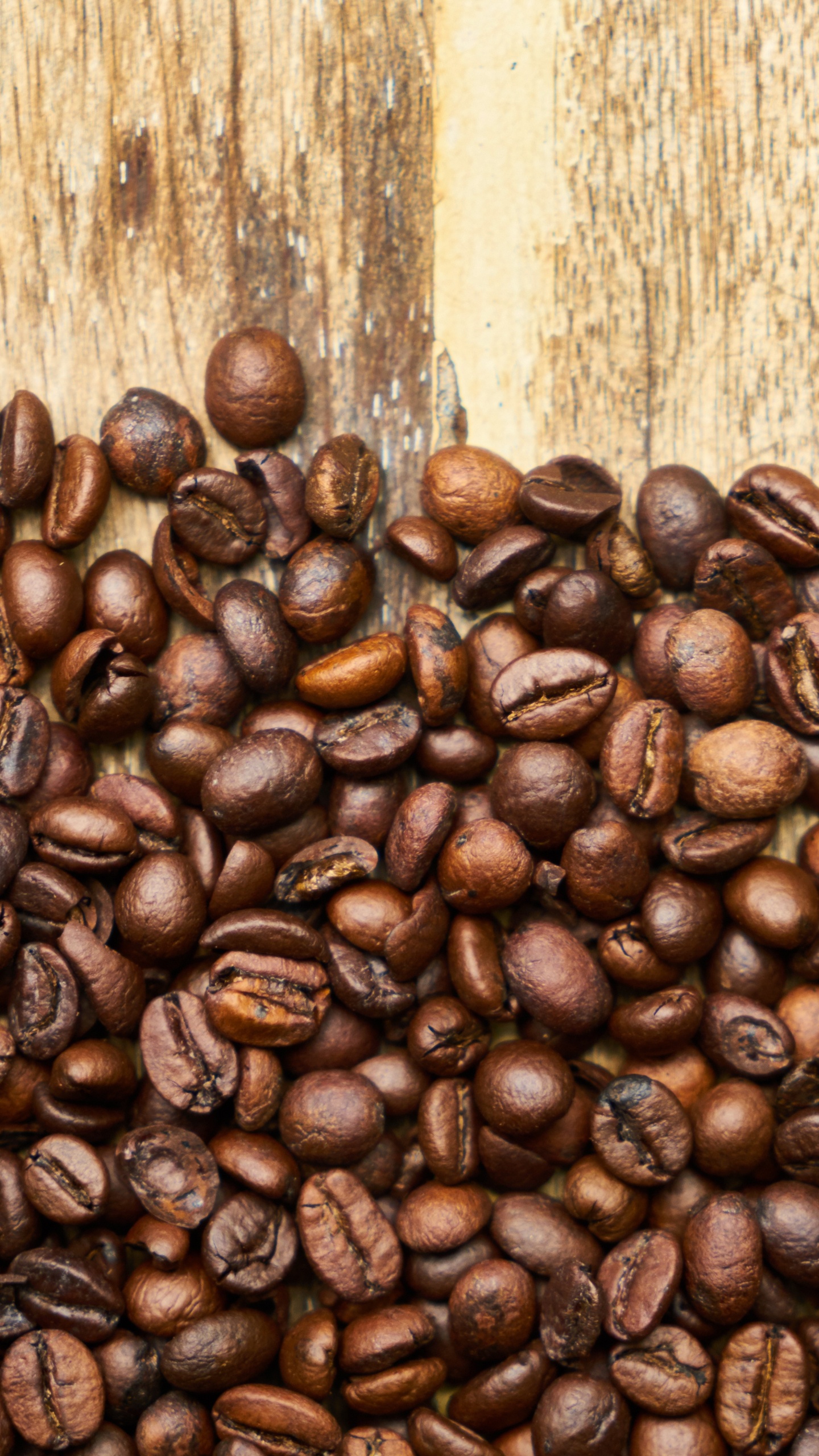 Coffee Beans on Brown Wooden Table. Wallpaper in 1440x2560 Resolution