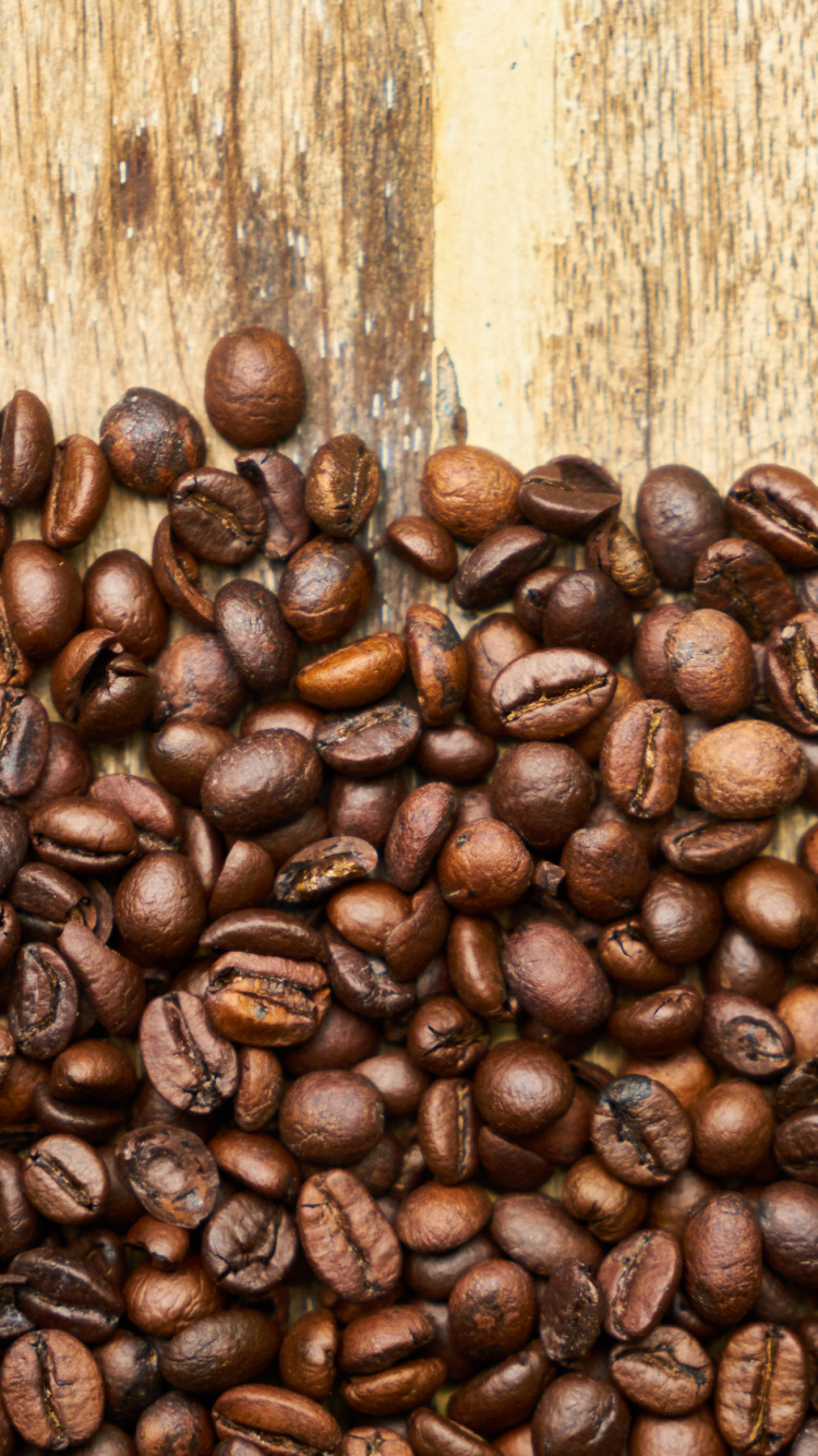 Coffee Beans on Brown Wooden Table. Wallpaper in 750x1334 Resolution