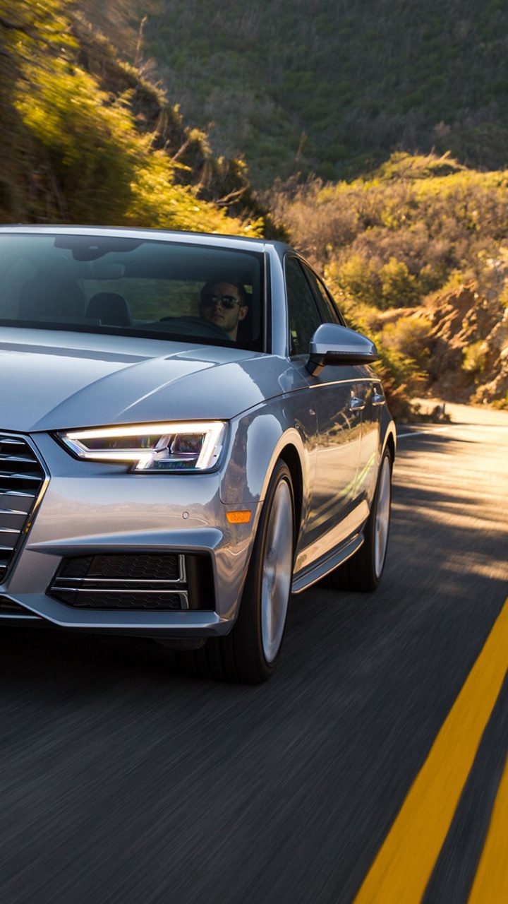 Audi Noir a 4 Sur Route Pendant la Journée. Wallpaper in 720x1280 Resolution