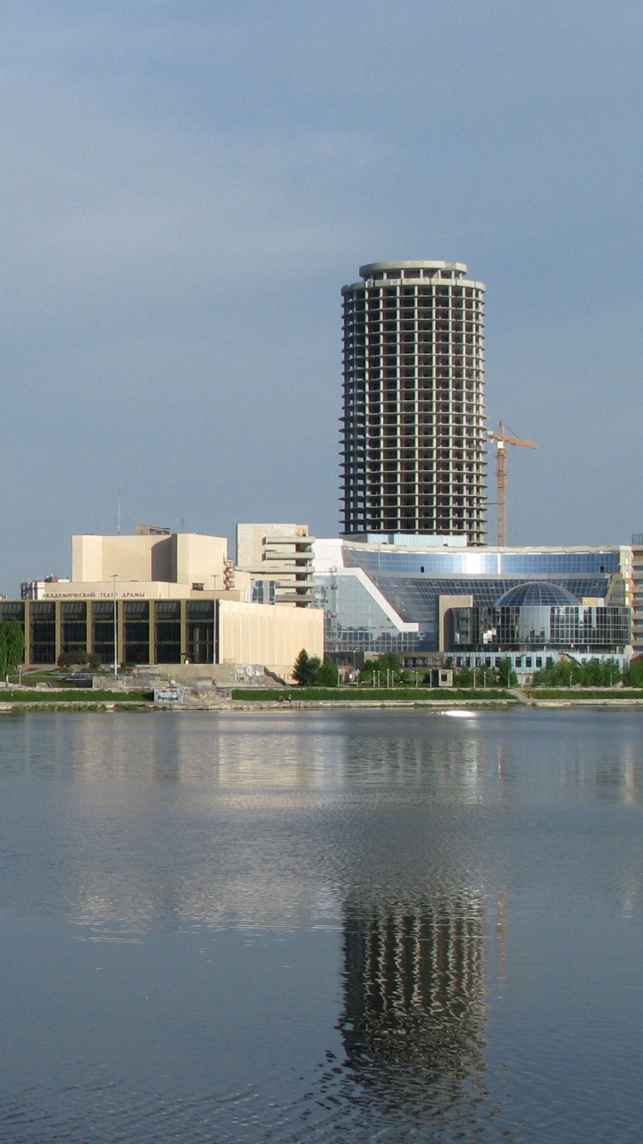 City Skyline Under Gray Sky During Daytime. Wallpaper in 720x1280 Resolution