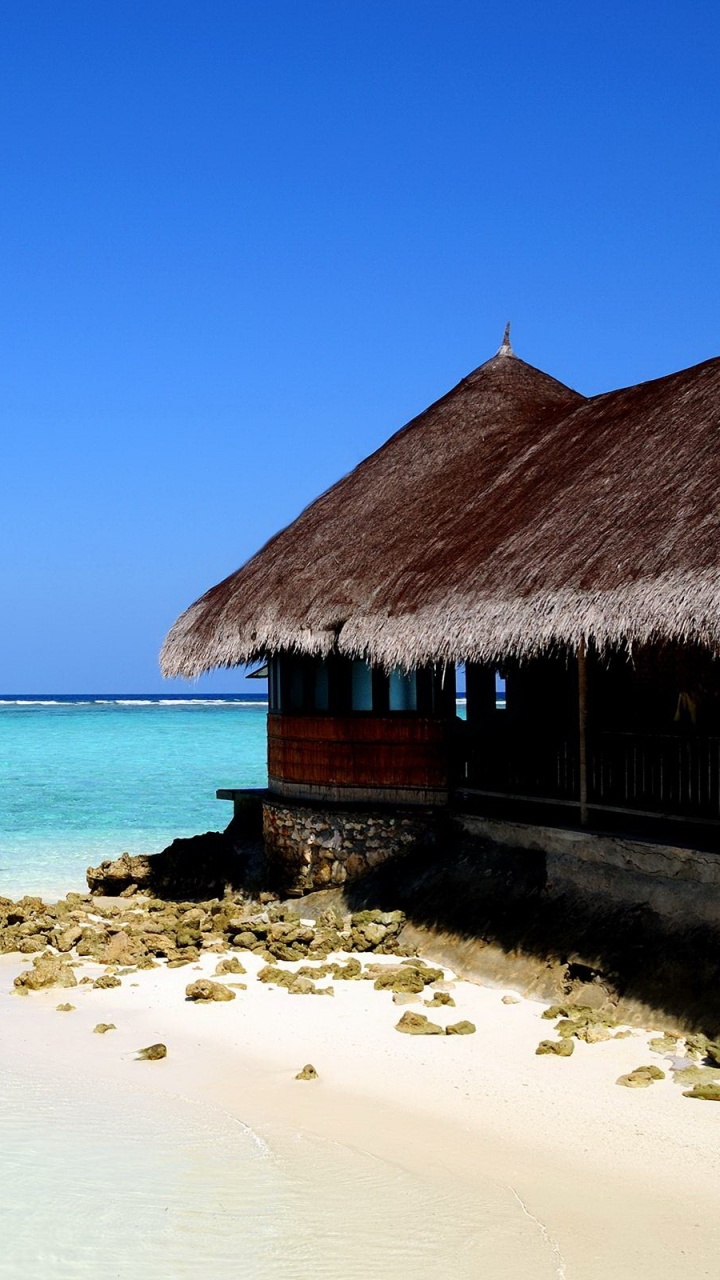 Brown Wooden House on Beach During Daytime. Wallpaper in 720x1280 Resolution