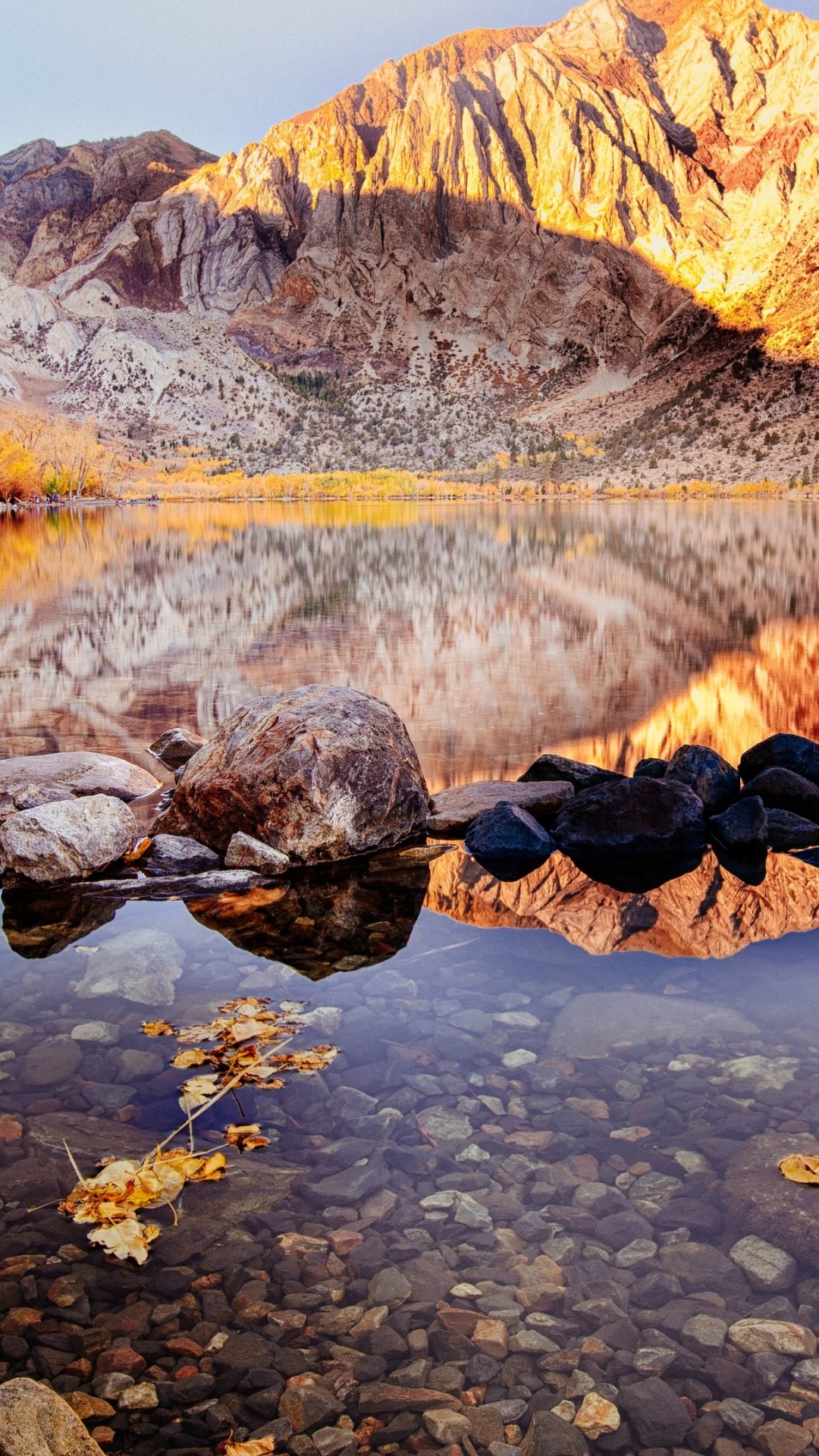 Brown Rocky Mountain Beside River During Daytime. Wallpaper in 1080x1920 Resolution