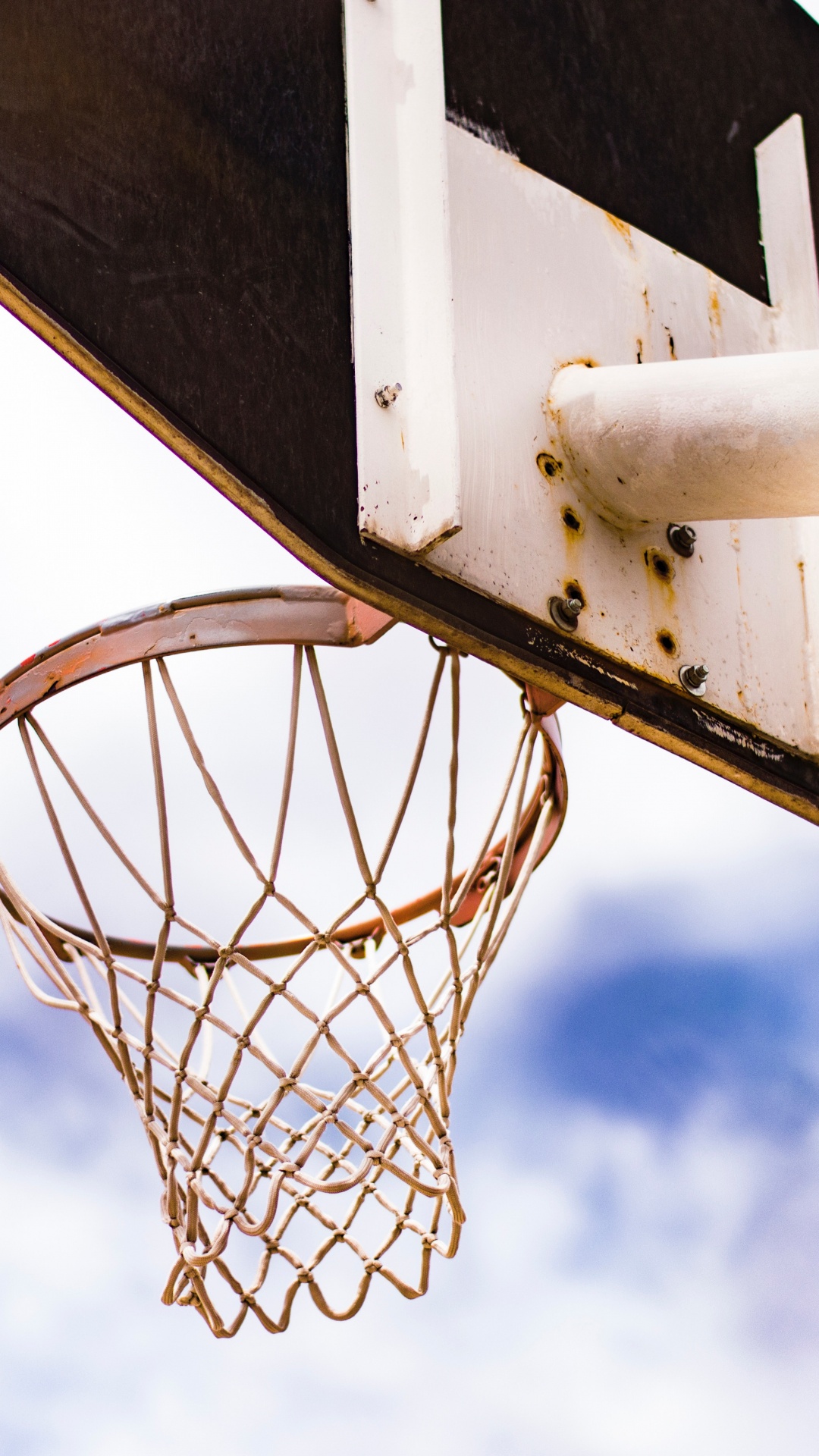White Basketball Hoop Under Blue Sky During Daytime. Wallpaper in 1080x1920 Resolution