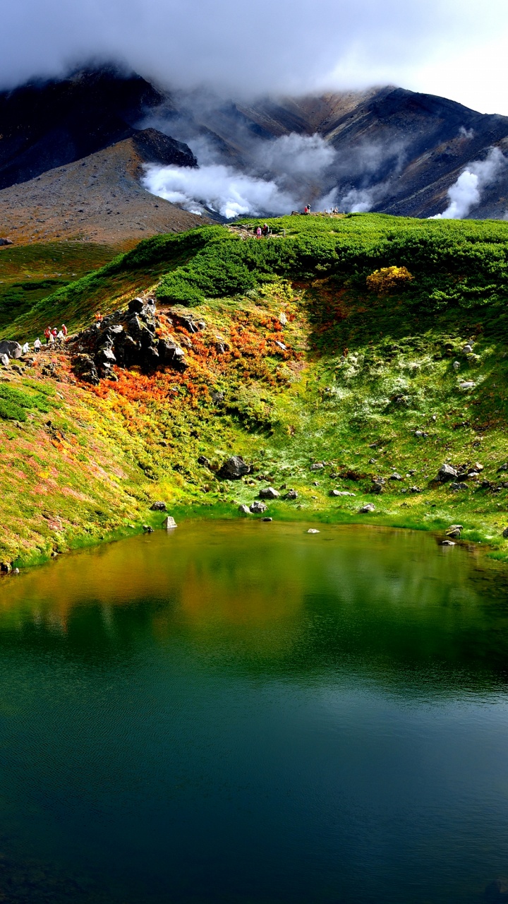 Green and Brown Mountain Beside Lake During Daytime. Wallpaper in 720x1280 Resolution