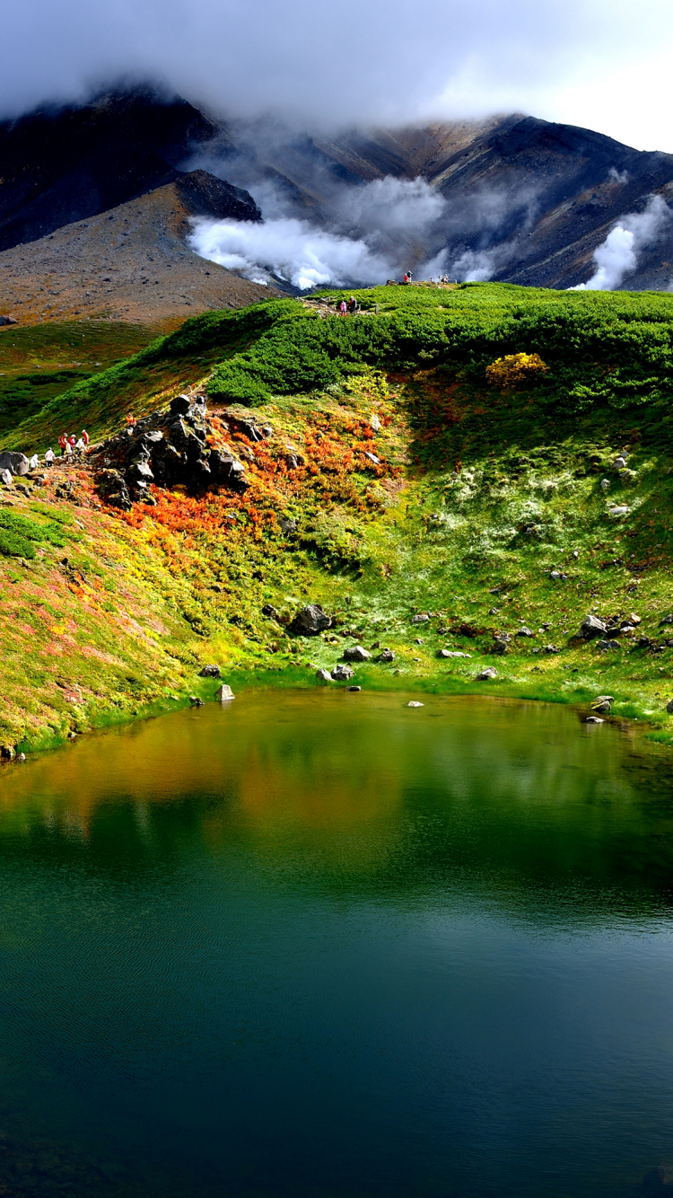 Green and Brown Mountain Beside Lake During Daytime. Wallpaper in 750x1334 Resolution