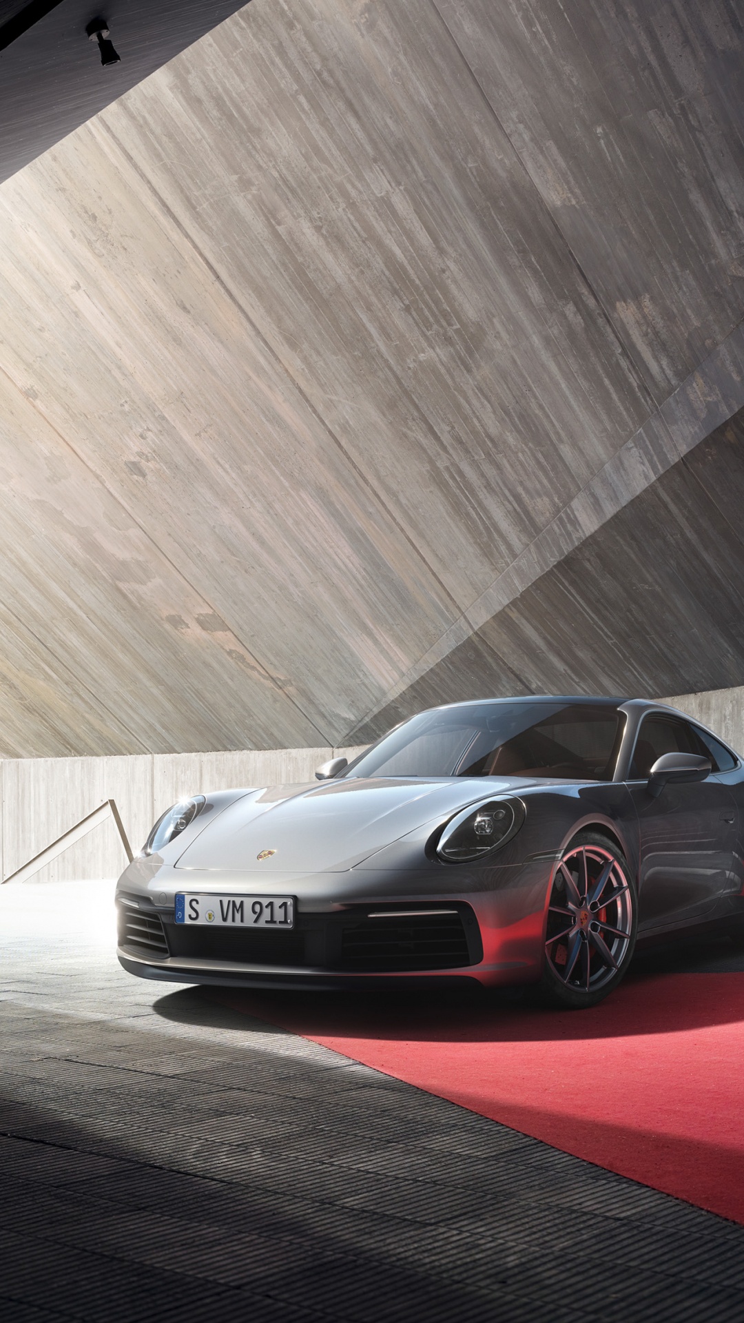 Silver Porsche 911 on a Gray Road. Wallpaper in 1080x1920 Resolution