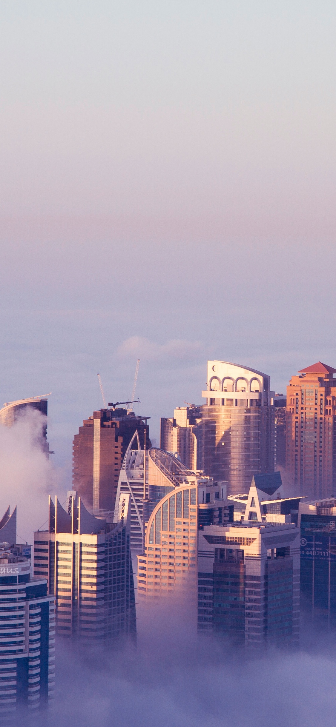 High Rise Buildings Under White Sky During Daytime. Wallpaper in 1125x2436 Resolution