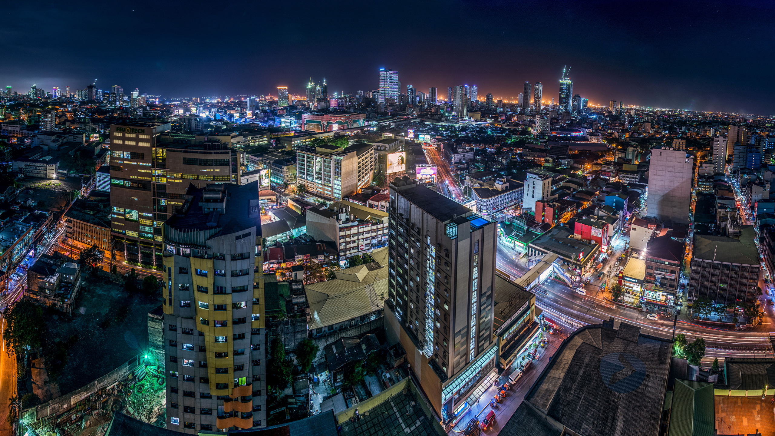 Aerial View of City Buildings During Night Time. Wallpaper in 2560x1440 Resolution