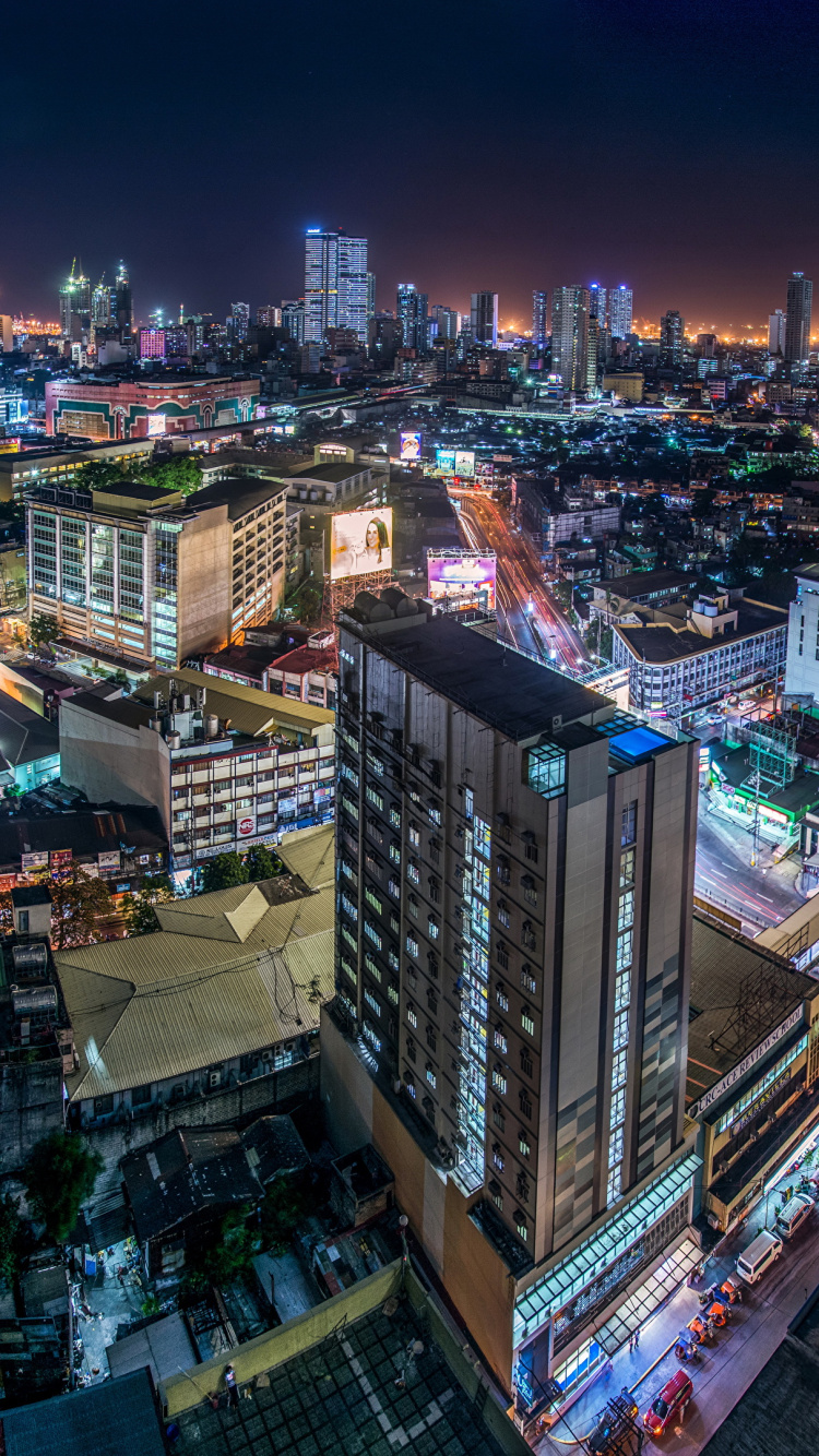 Aerial View of City Buildings During Night Time. Wallpaper in 750x1334 Resolution