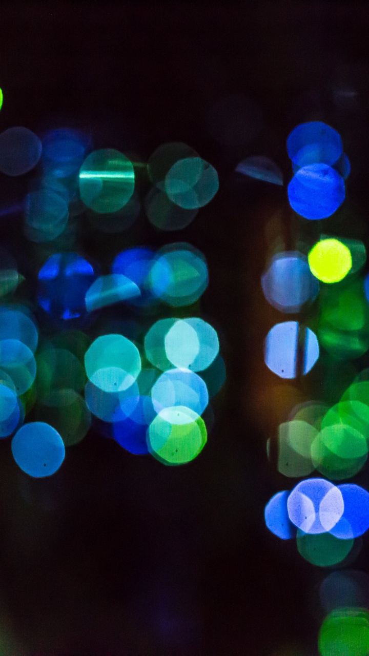 Green and Blue Bokeh Lights. Wallpaper in 720x1280 Resolution