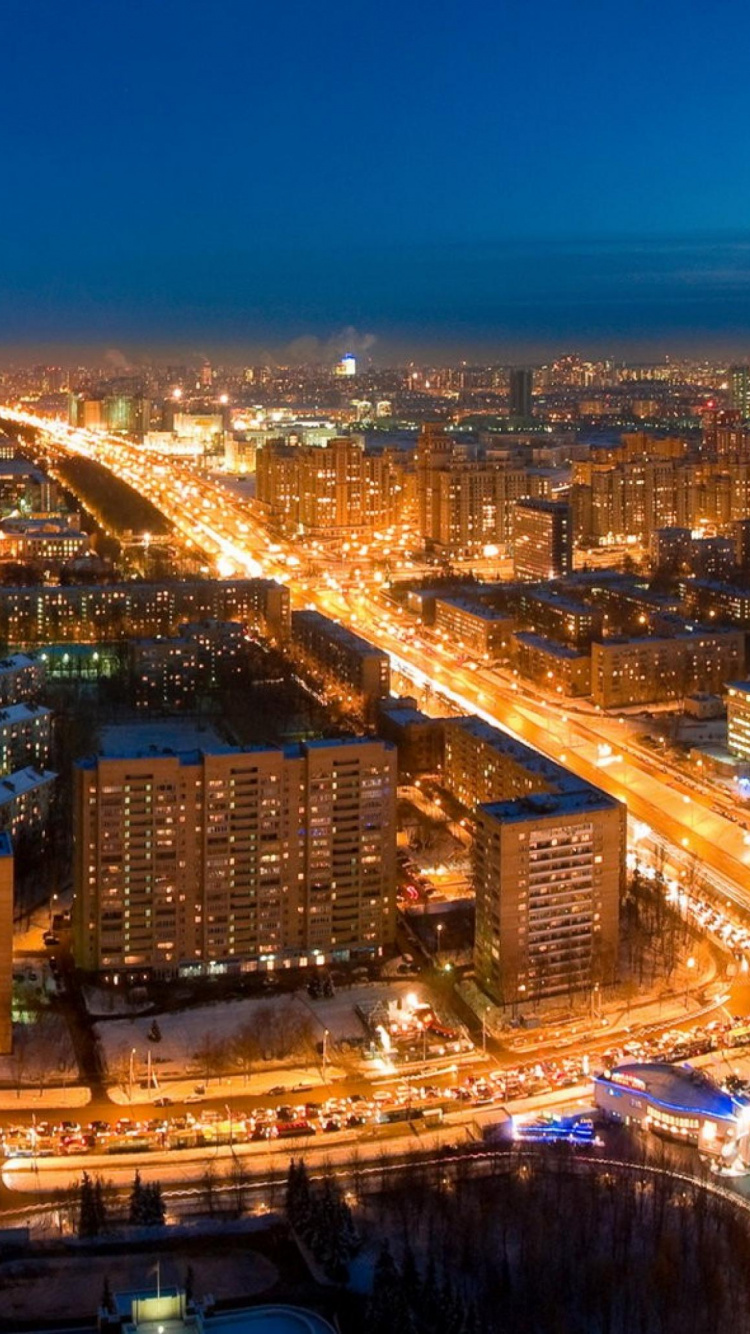 Aerial View of City Buildings During Night Time. Wallpaper in 750x1334 Resolution