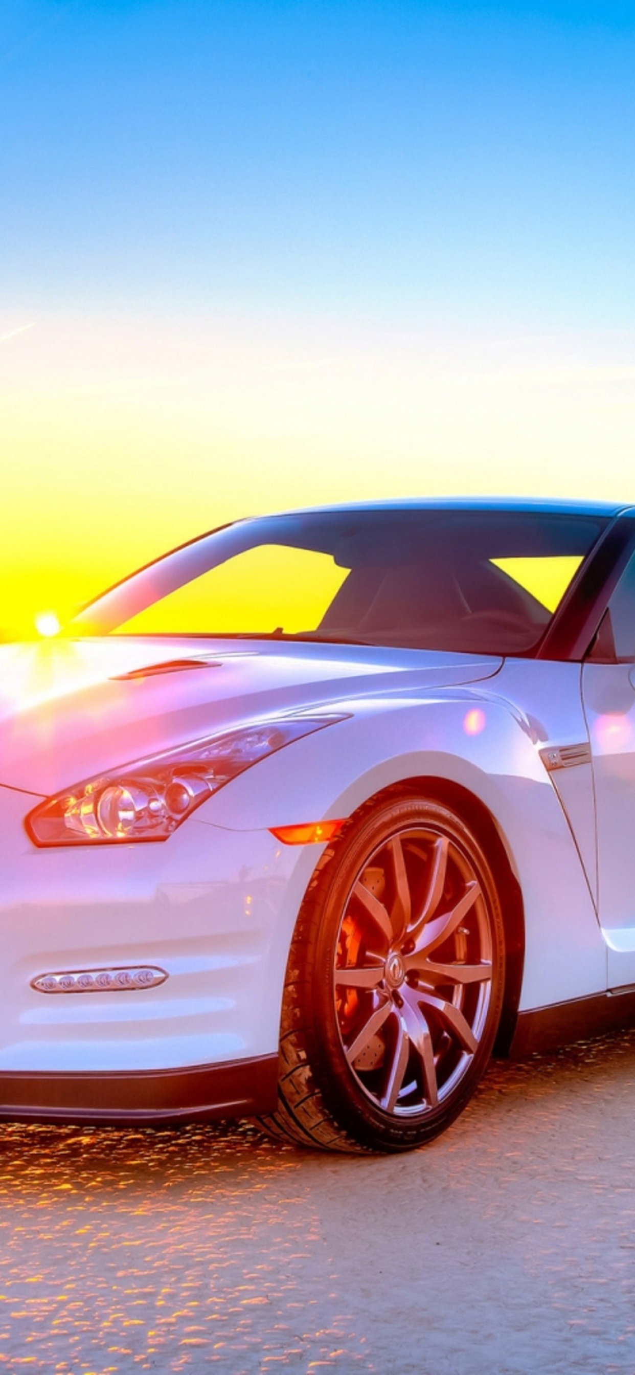 White and Black Porsche 911 on Gray Asphalt Road During Sunset. Wallpaper in 1242x2688 Resolution