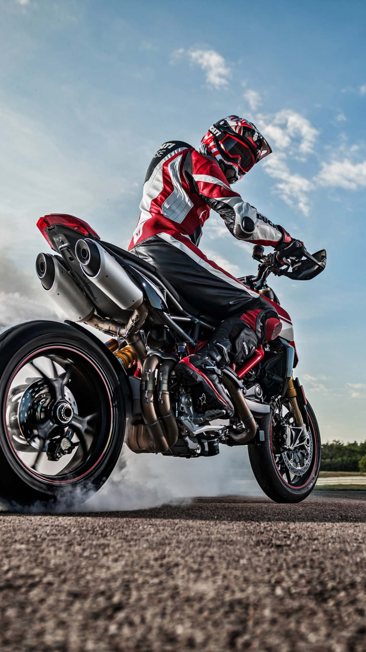 Man in Red and White Racing Suit Riding on Red and White Sports Bike. Wallpaper in 750x1334 Resolution