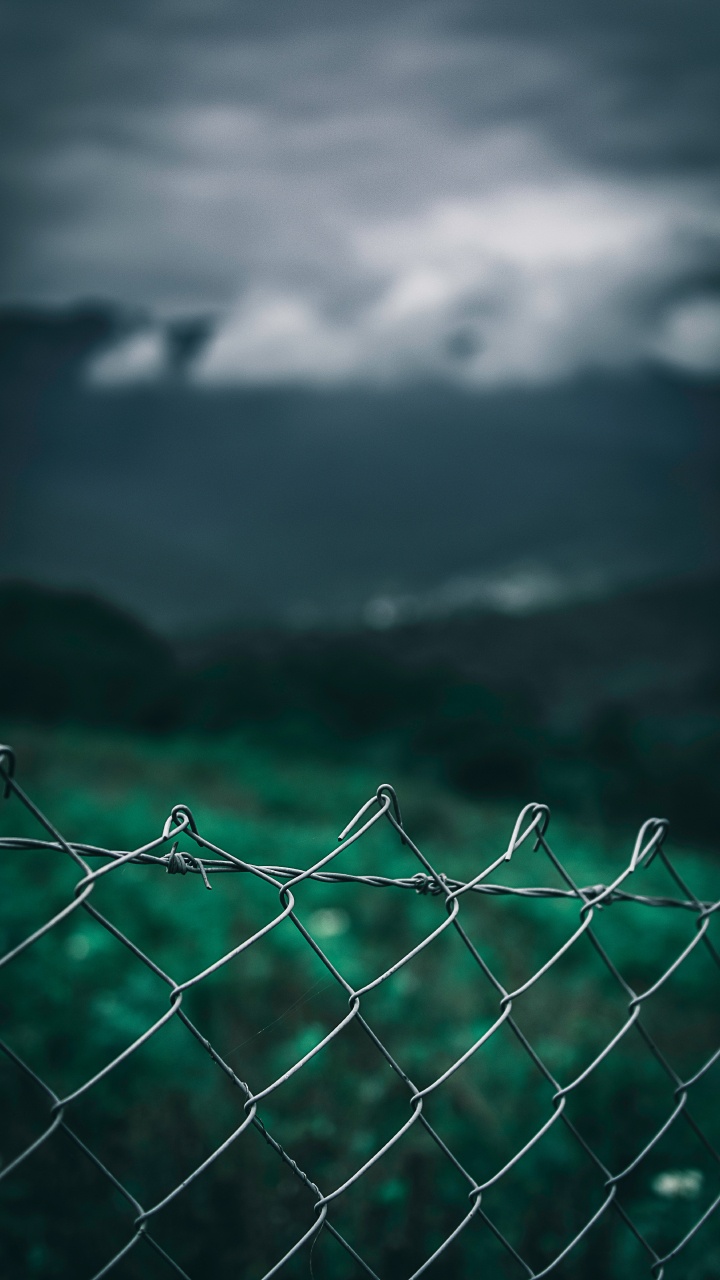 Gray Metal Fence With Water Droplets. Wallpaper in 720x1280 Resolution