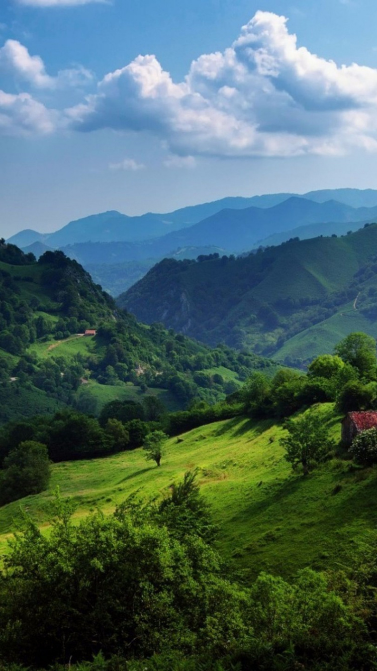 Green Mountains Under Blue Sky During Daytime. Wallpaper in 750x1334 Resolution
