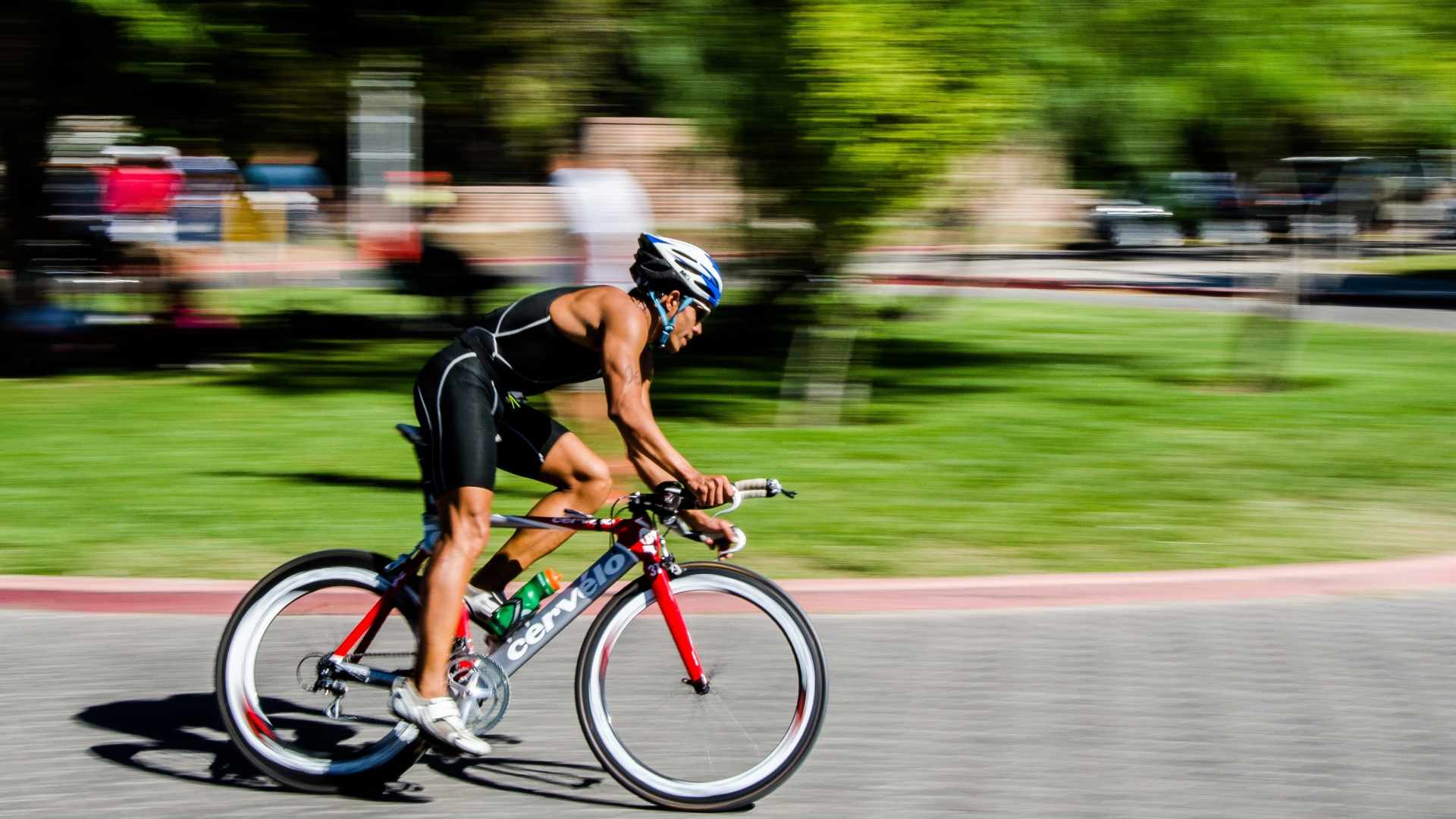 Man in Black Shirt Riding on Red and Black Road Bike. Wallpaper in 1920x1080 Resolution