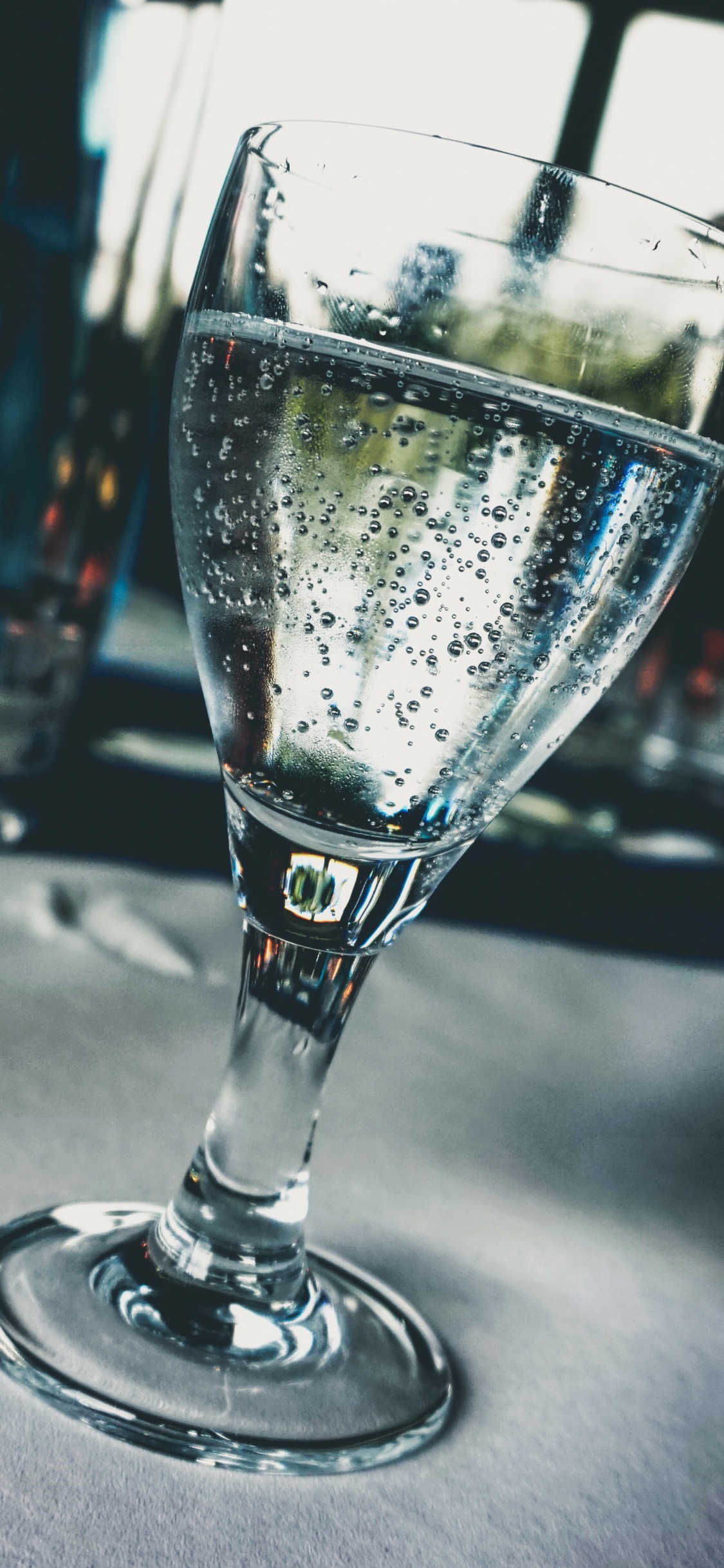 Clear Drinking Glass With Water. Wallpaper in 1125x2436 Resolution