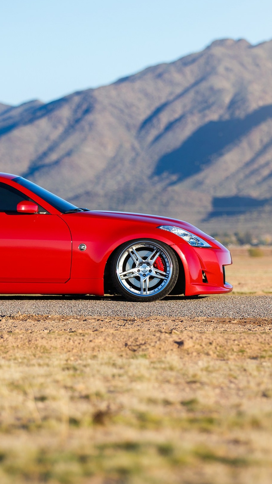 Red Ferrari Coupe on Road During Daytime. Wallpaper in 1080x1920 Resolution