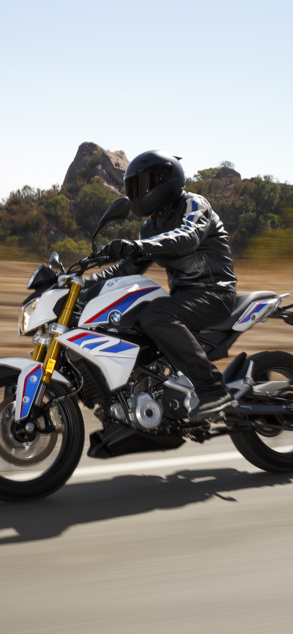 Man in Black Jacket Riding Blue and White Sports Bike on Road During Daytime. Wallpaper in 1242x2688 Resolution