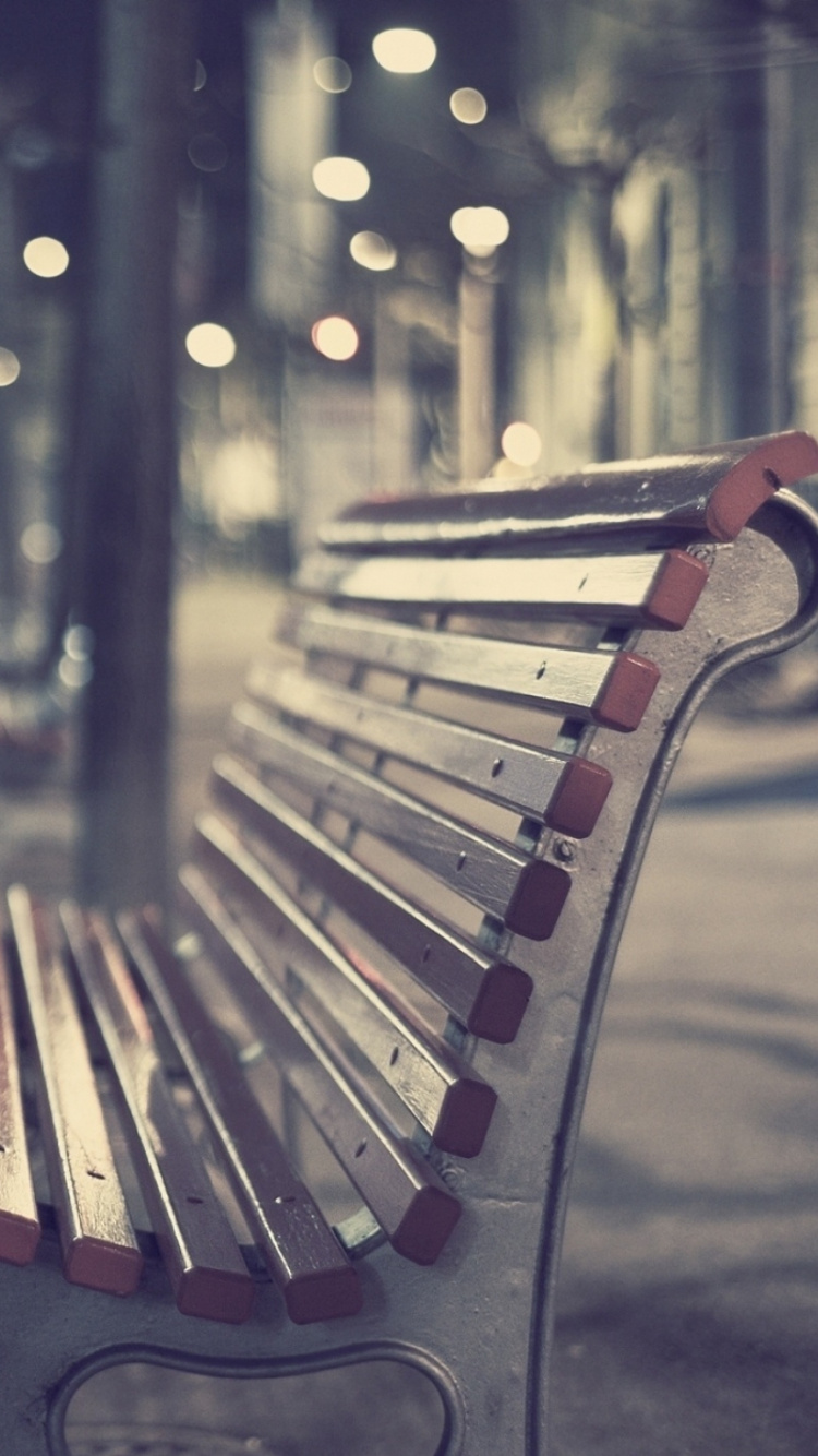 Brown Wooden Bench on Sidewalk During Night Time. Wallpaper in 750x1334 Resolution
