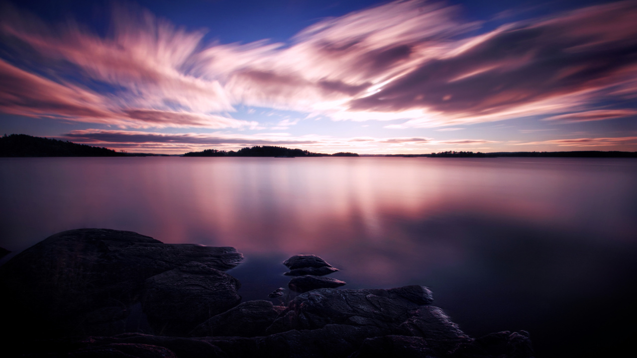 Calm Water Under Blue Sky During Daytime. Wallpaper in 1280x720 Resolution