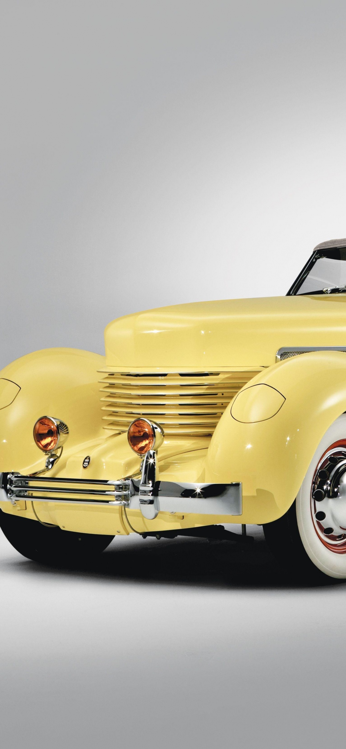 Yellow Vintage Car on White Background. Wallpaper in 1125x2436 Resolution