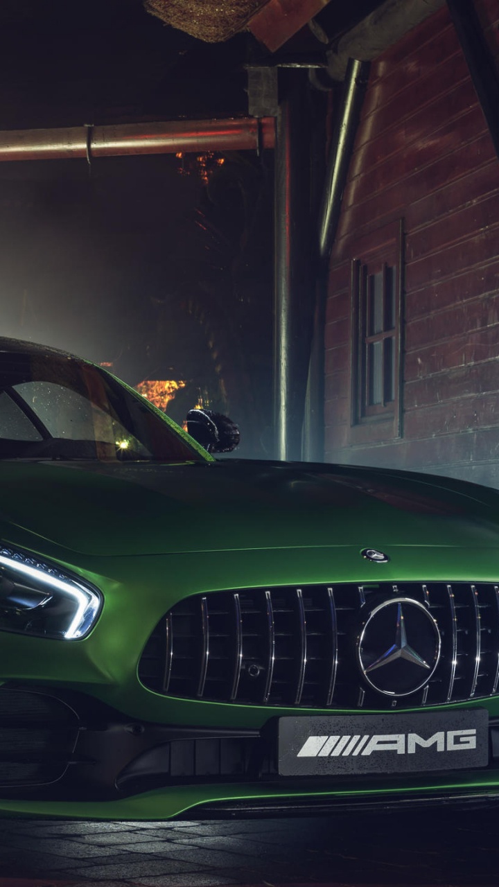 Green Porsche 911 Parked in Garage. Wallpaper in 720x1280 Resolution