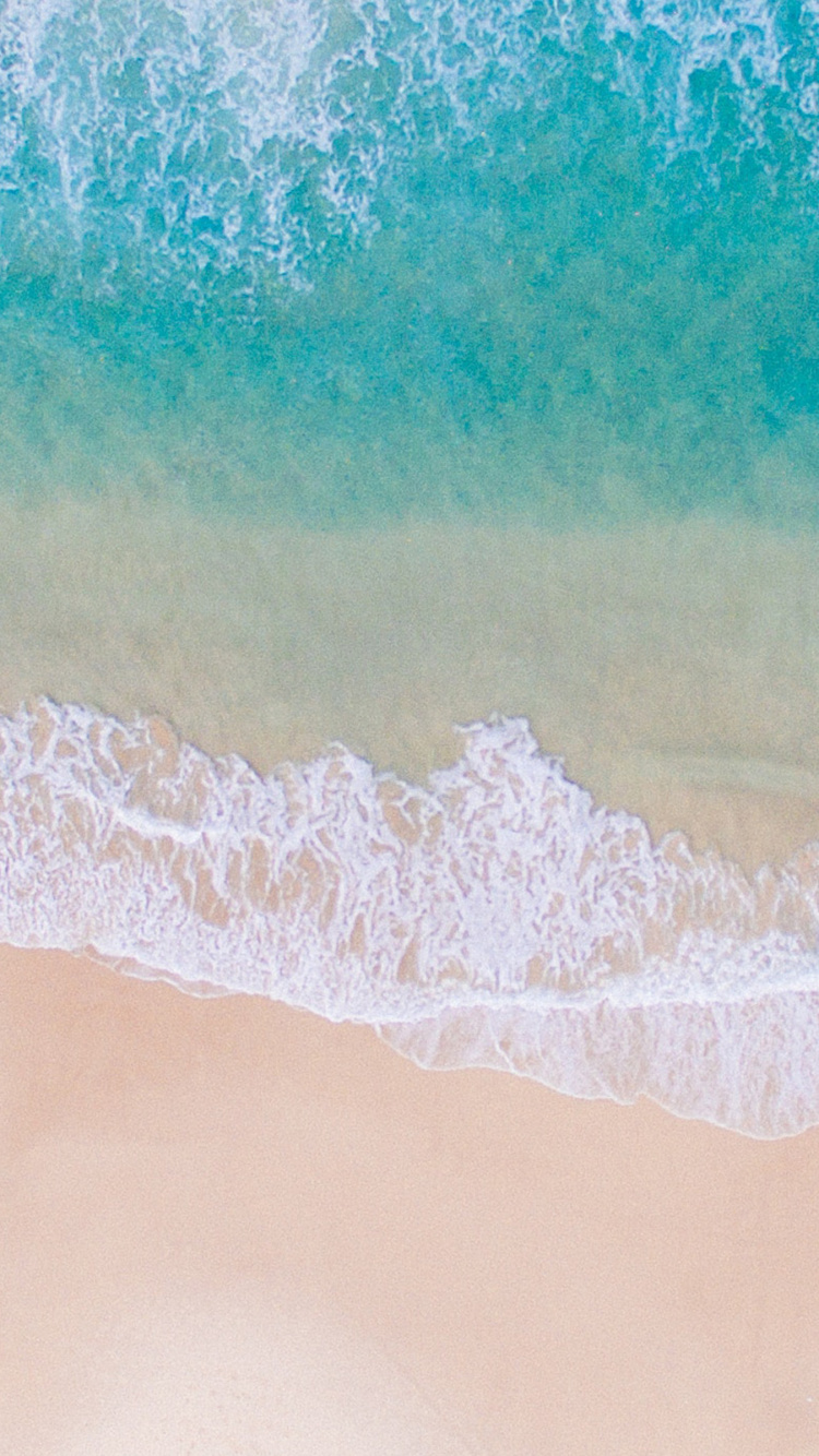 Ocean Waves Crashing on Shore During Daytime. Wallpaper in 750x1334 Resolution