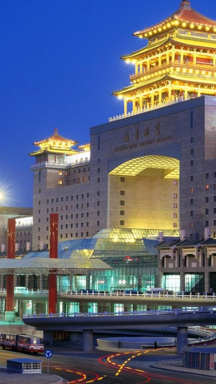 White Concrete Building Near Body of Water During Daytime. Wallpaper in 750x1334 Resolution