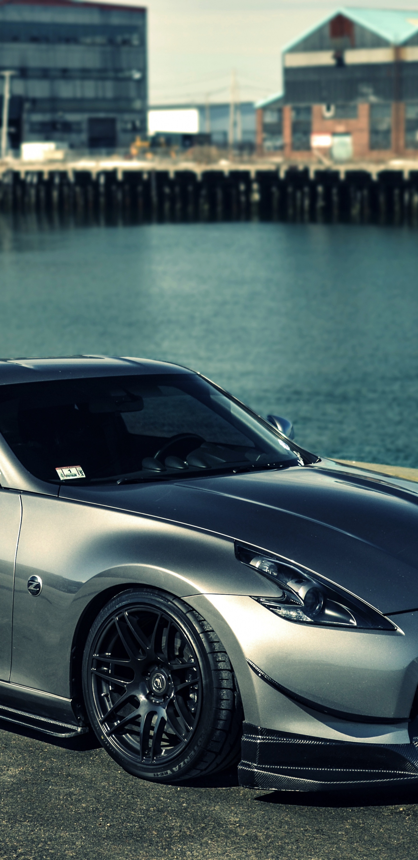 Silver Porsche 911 Estacionado Cerca Del Cuerpo de Agua Durante el Día. Wallpaper in 1440x2960 Resolution